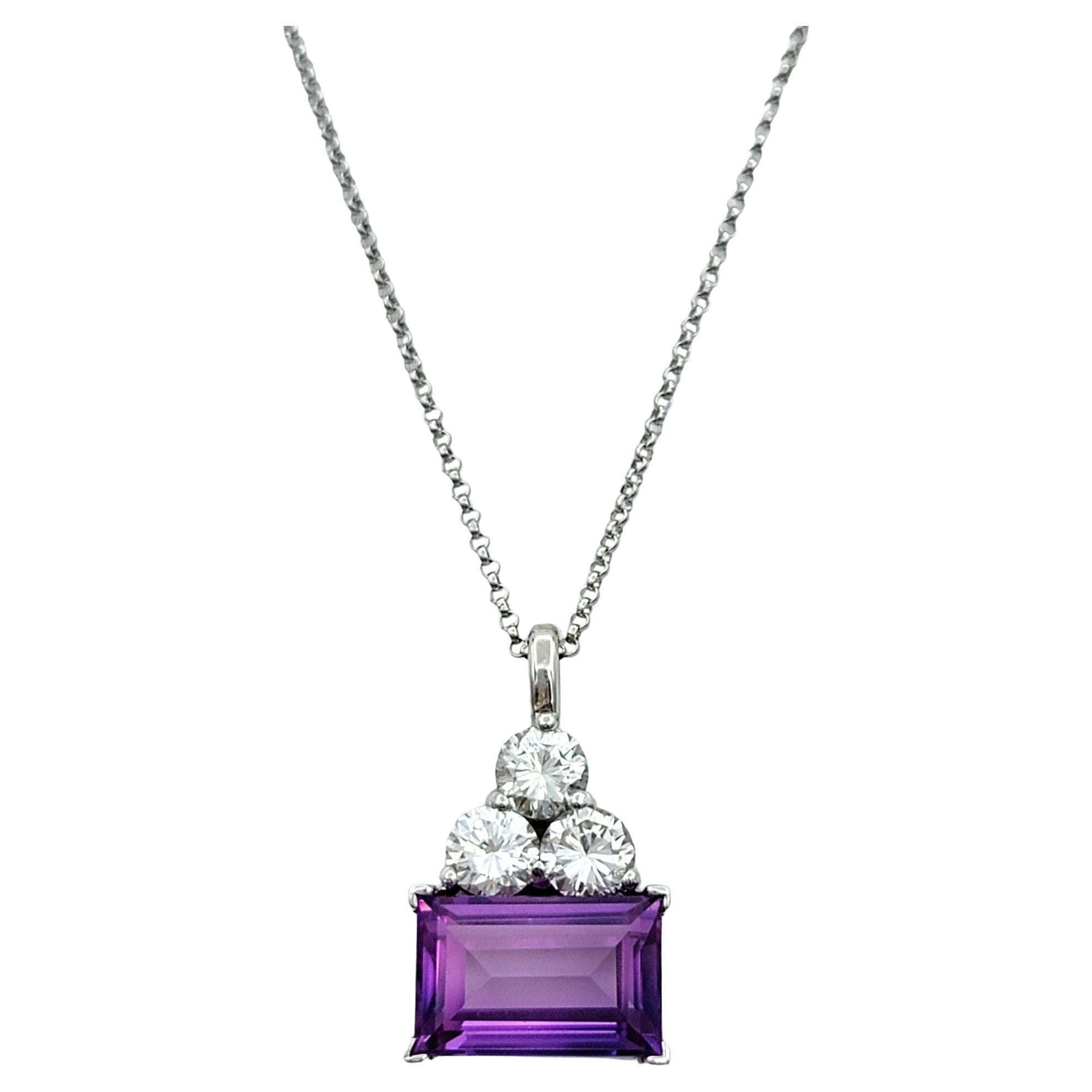 Indulge in the impeccable craftsmanship of this Oliver Smith pendant necklace, a testament to refined luxury and timeless elegance. Set in gleaming 18 karat white gold, the pendant features a mesmerizing emerald cut amethyst of exceptional clarity