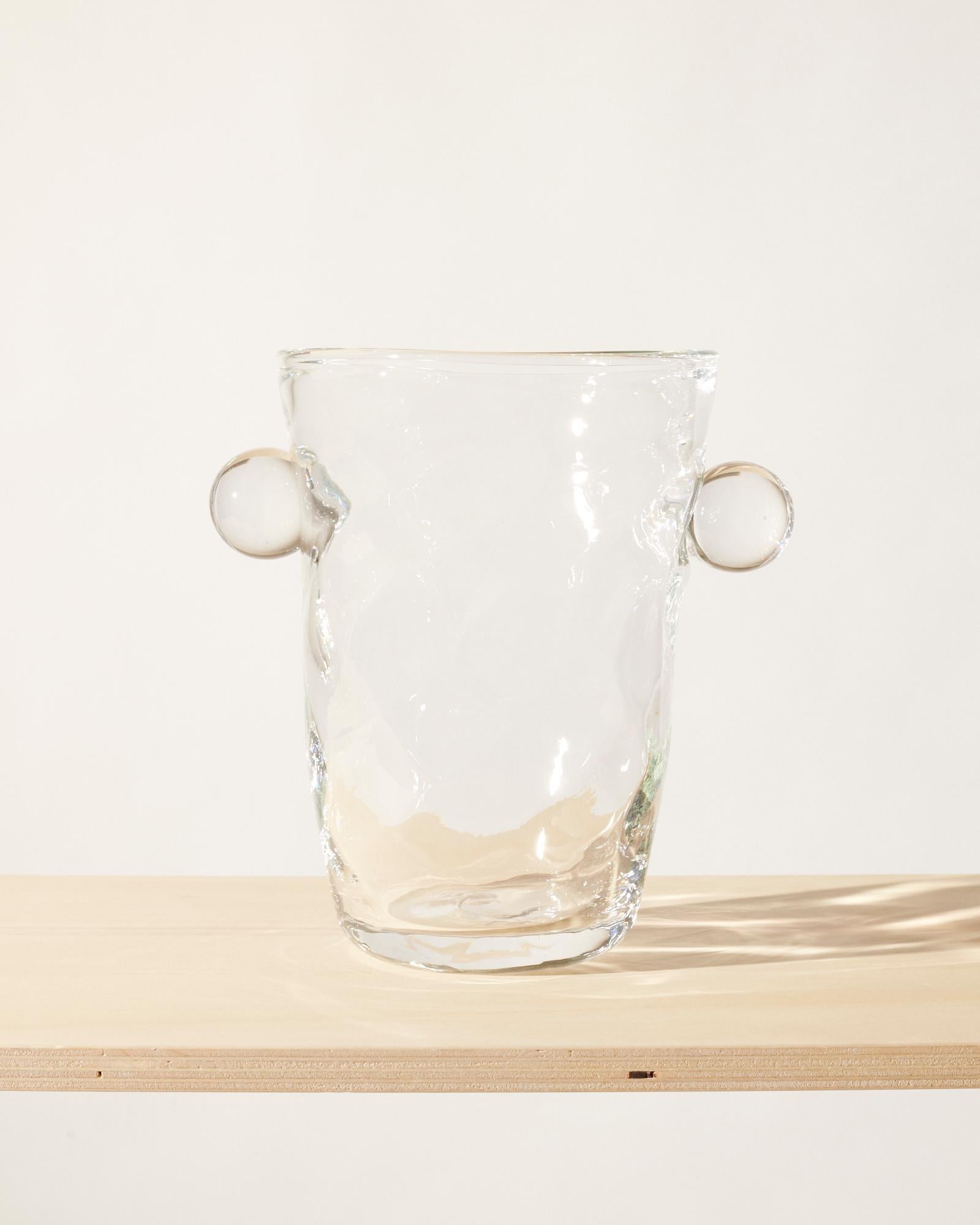 Mouth-blown and handmade Bohemian Glassware.
Made in Bohemia.

Ideal to be displayed in a window or as a centrepiece with flowers.  

The Oliver vase is named after friend and muse of Akua Objects, Oliver Fussing.
Different shapes meet and create a
