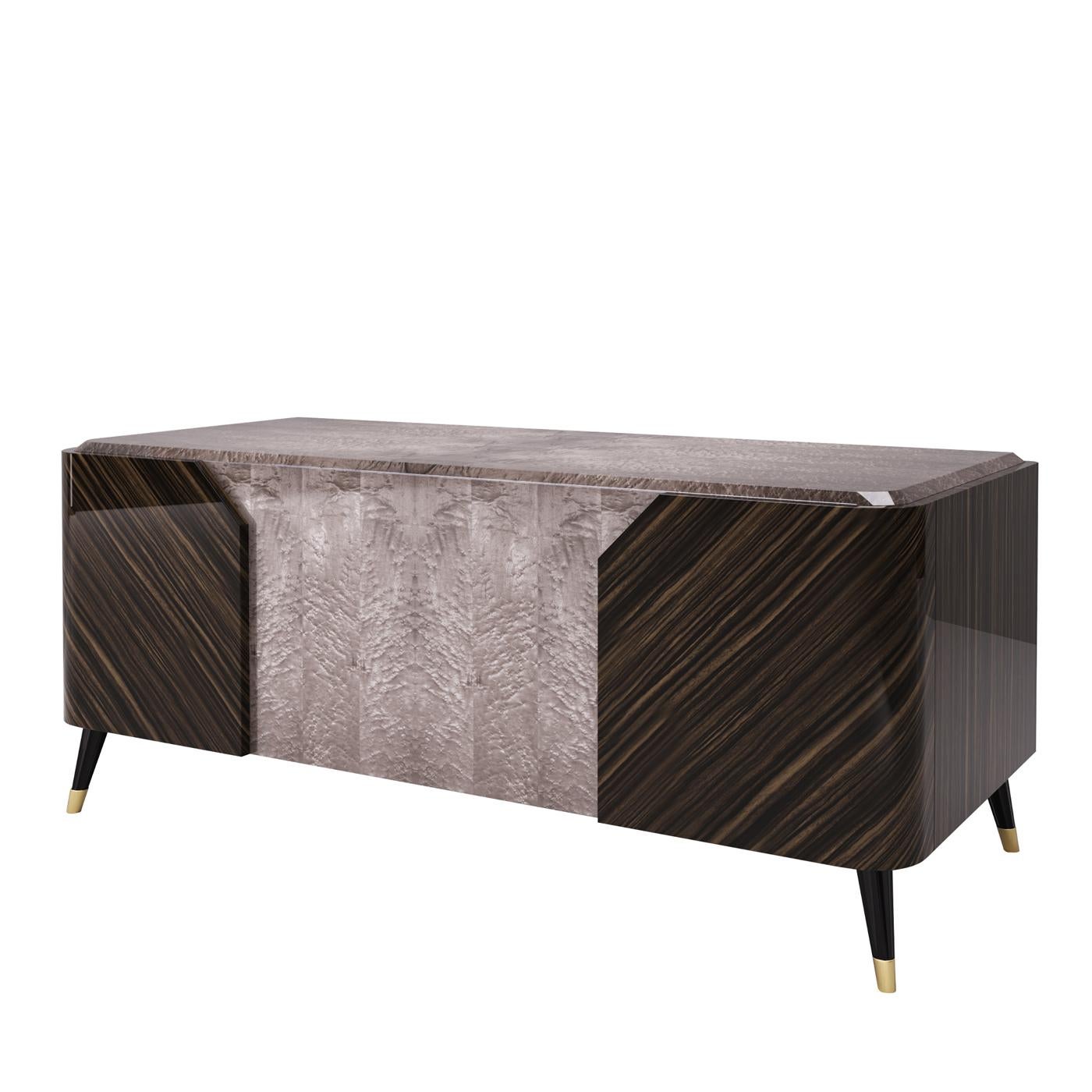 Blending form with function, this elegant desk is the perfect sophisticated pick for the office. The thick wood desktop is in a gray hue, while the body and sides of this piece are in a dark ebony finish. Practical drawers on each side will hold all