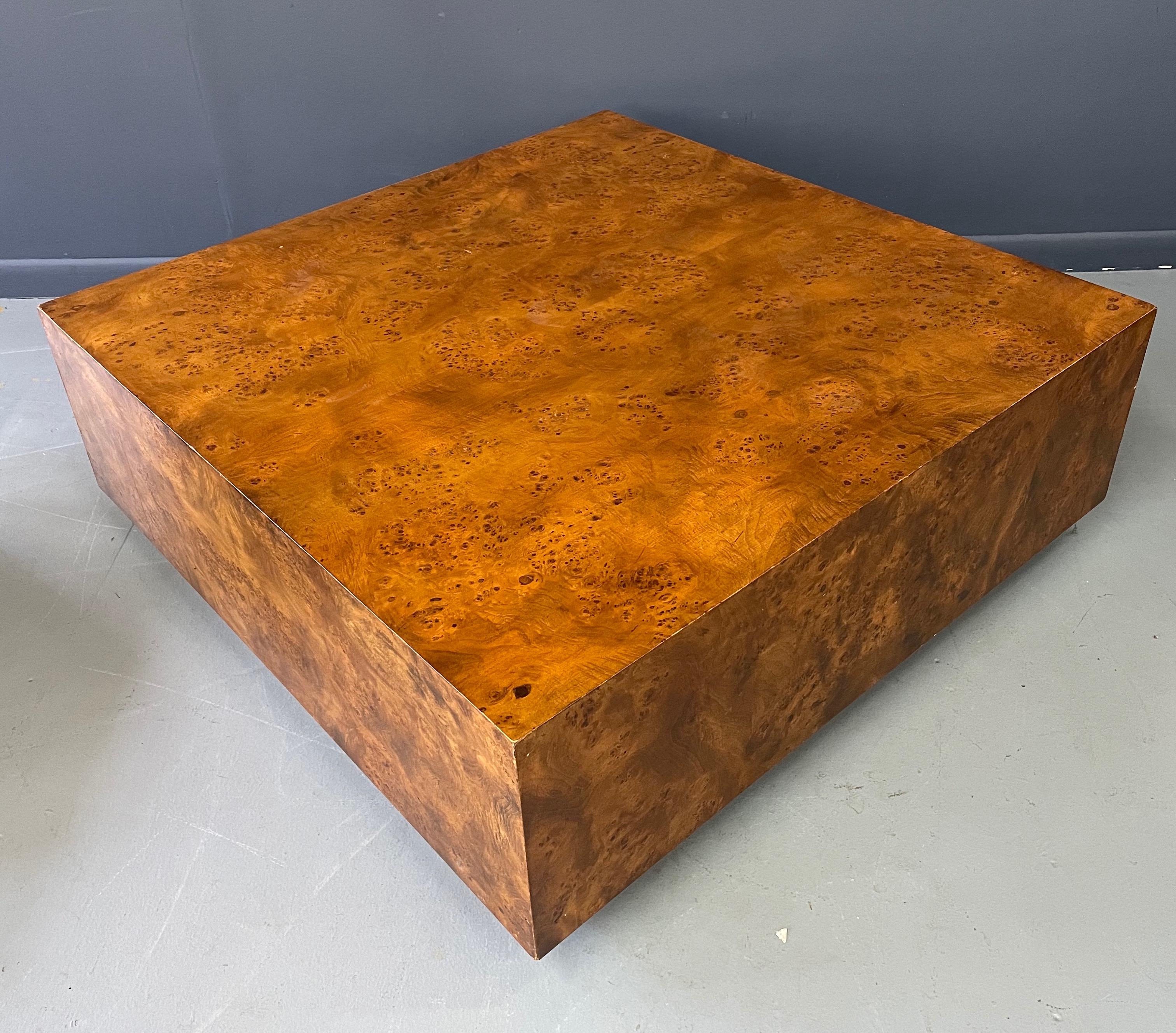 Beautiful and generously proportioned burl cocktail table on wheels!