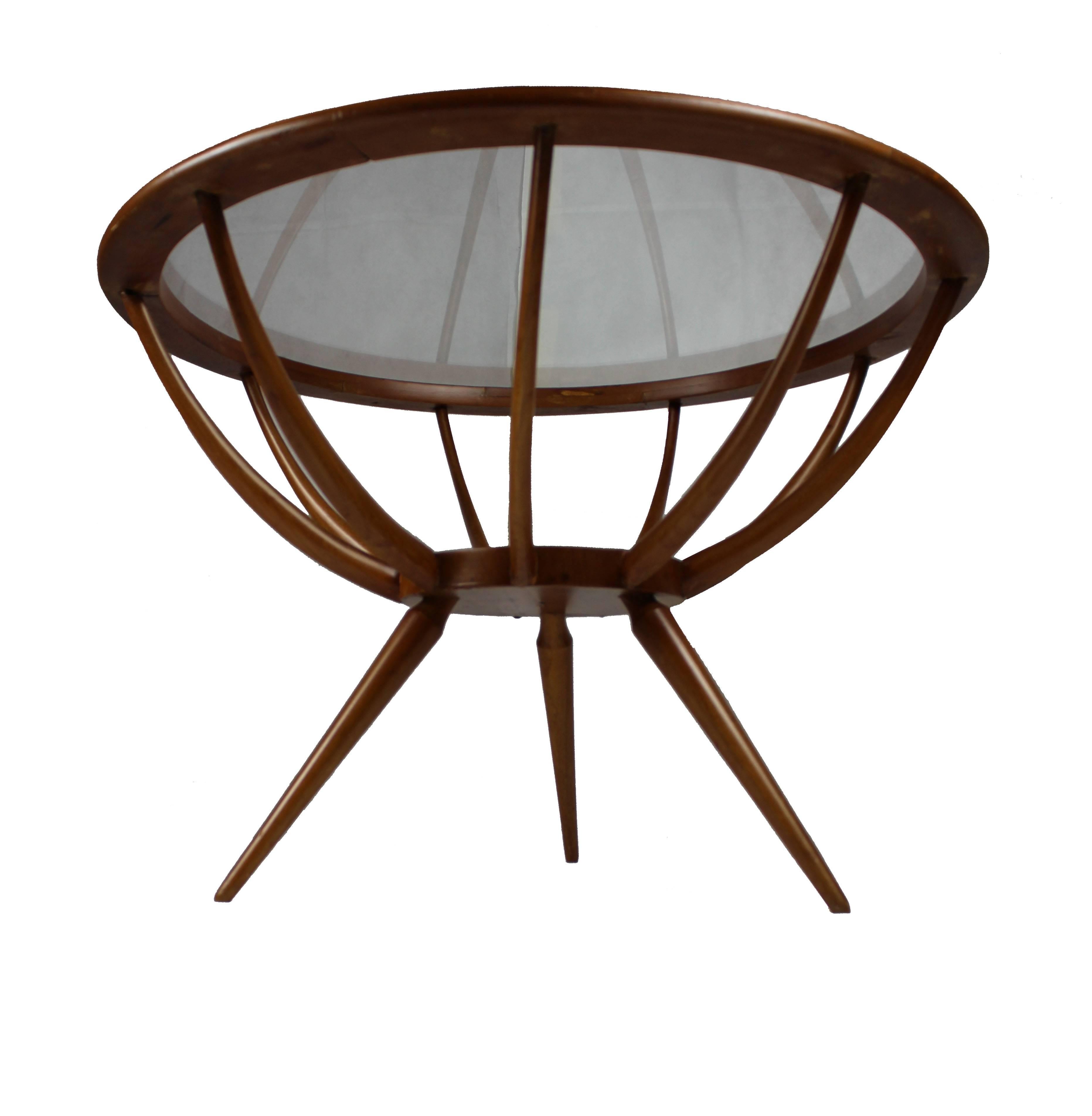 Spider table made of olivewood and glass. The glass is sustained by a brass ring. Made in Italy, circa 1950s. Restored.