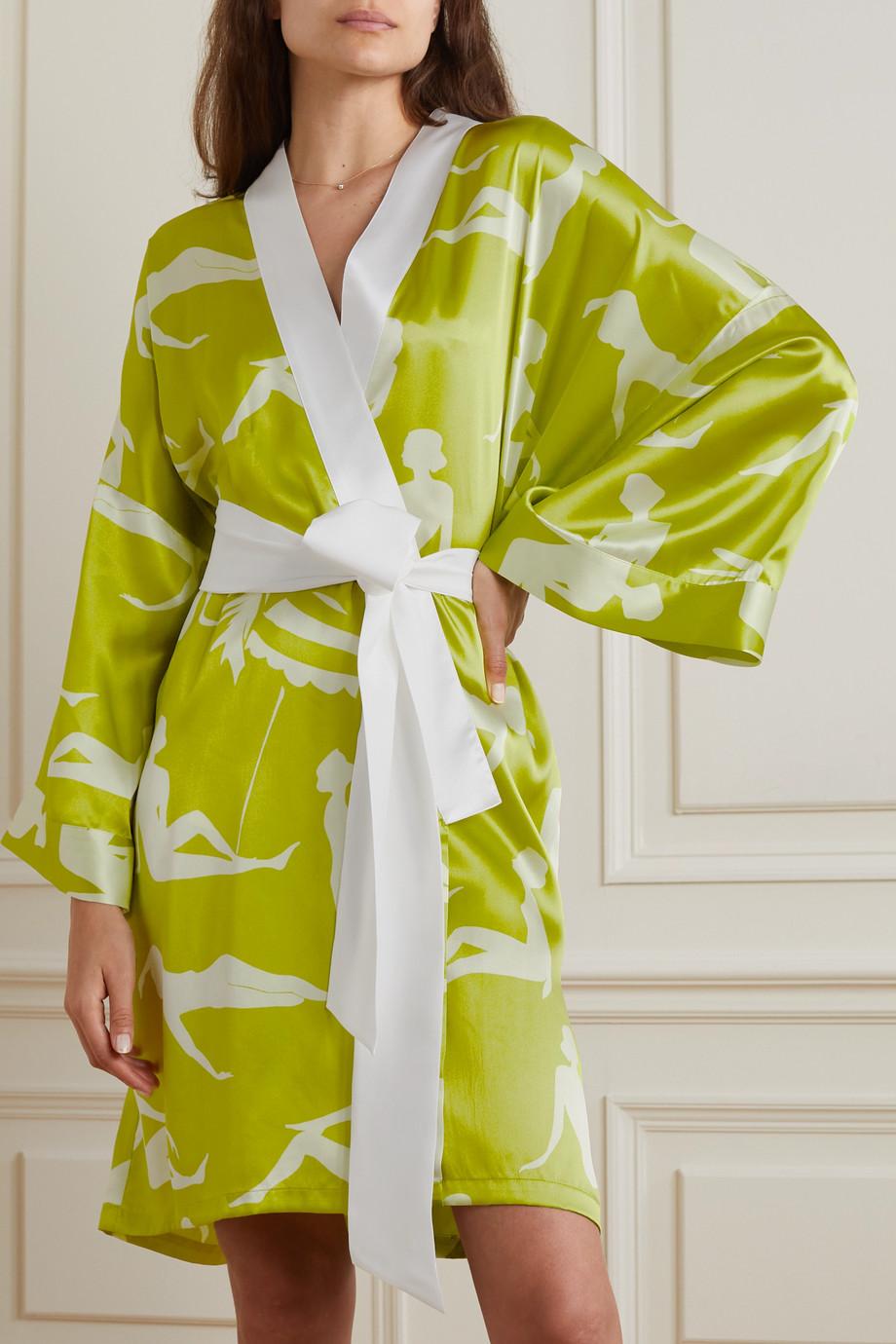 Olivia von Halle's robe is cut from soft silk-satin in a kimono-inspired silhouette. It is in lime color printed all-over with silhouette print. Finished piping, it has wide sleeves.  Wear yours while lounging around the house or over a dress in the