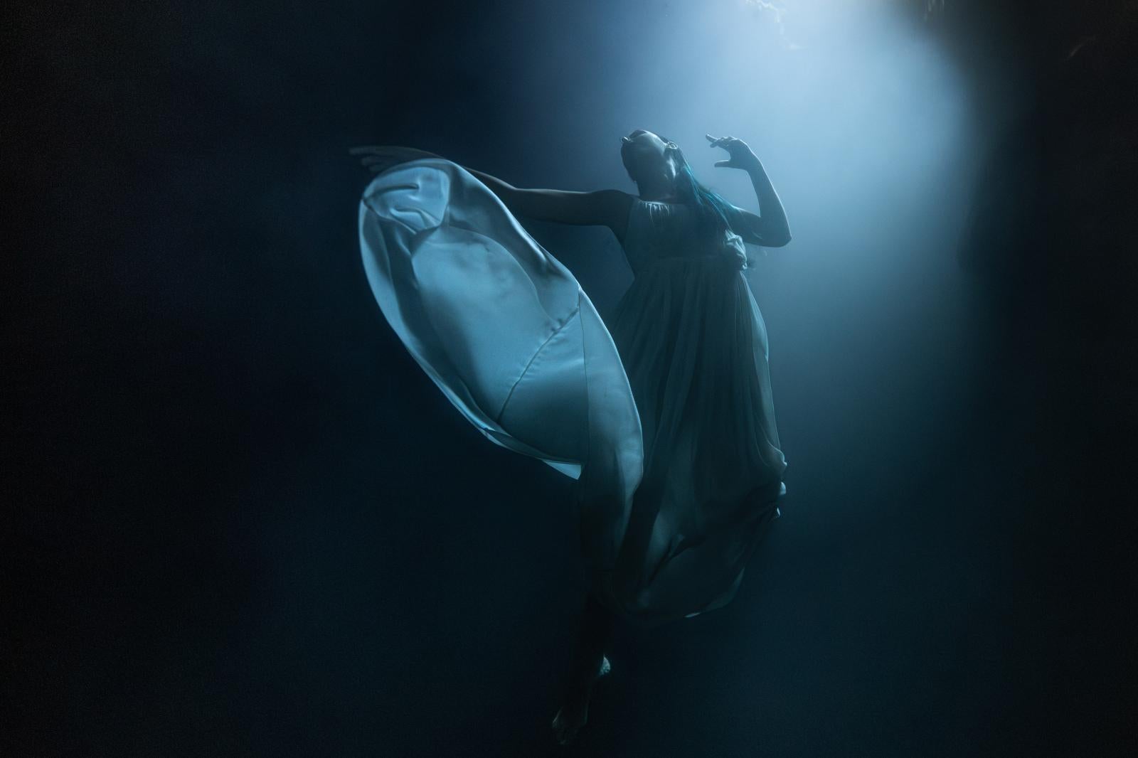 Olivier Borde Figurative Photograph - Vanessa into the Blue- Fine art print, Color underwater photography with a model