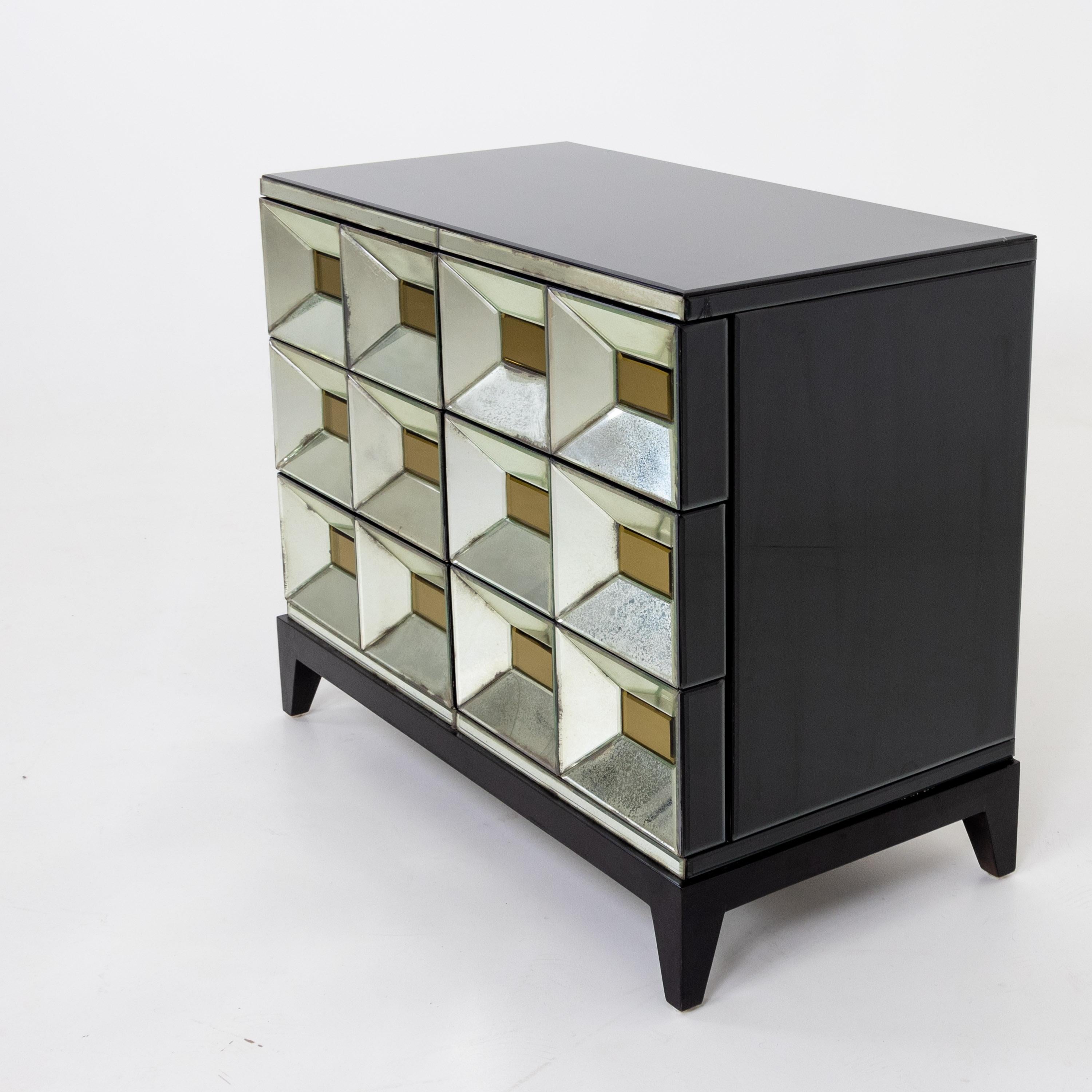 Six-drawer dresser from the Ode's Design series by Olivier de Schrijver with mirrored surfaces with gold-colored panes and dark glass top. Signed, inscribed and numbered on the back.