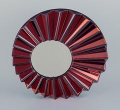Olivier de Schrijver, designer français. Miroir mural futuriste "Simba Rouge