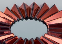 Olivier de Schrijver, designer français. Miroir mural futuriste "Simba Rouge