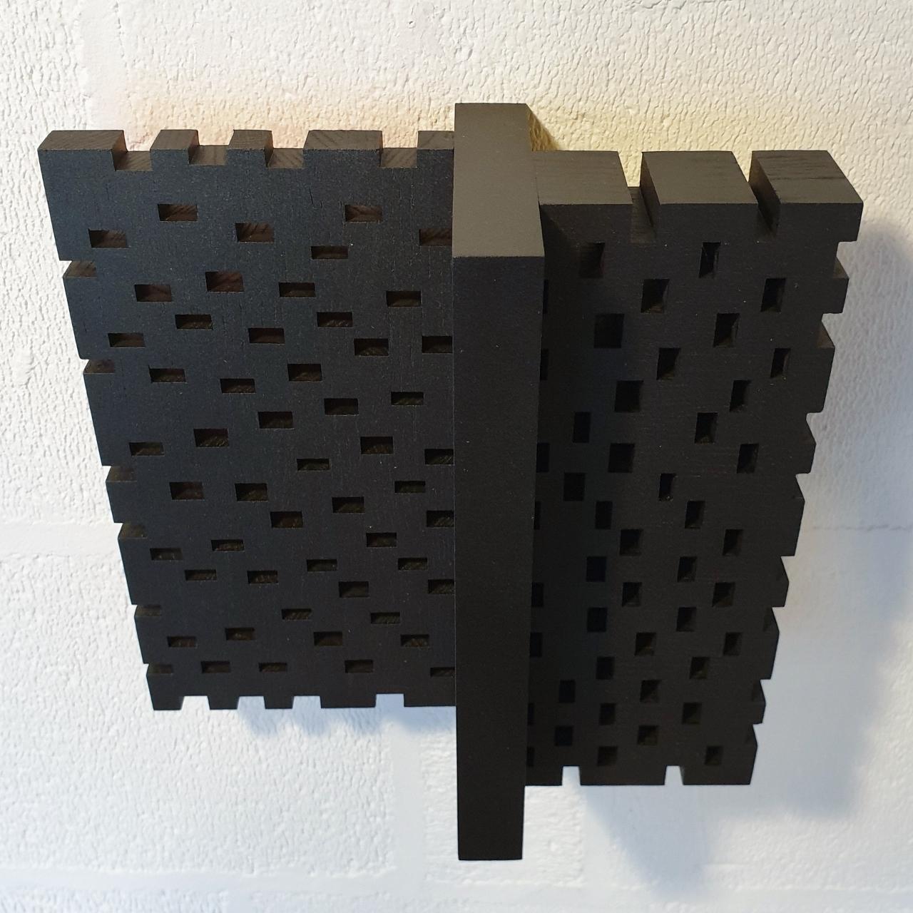 Superposition urbaine 23/30 is a medium size contemporary modern sculpture painting relief by French-Dutch artist Olivier Julia. It is made from wood and mdf, with the front side finished with his well-known mixture of anthracite grey and bronze