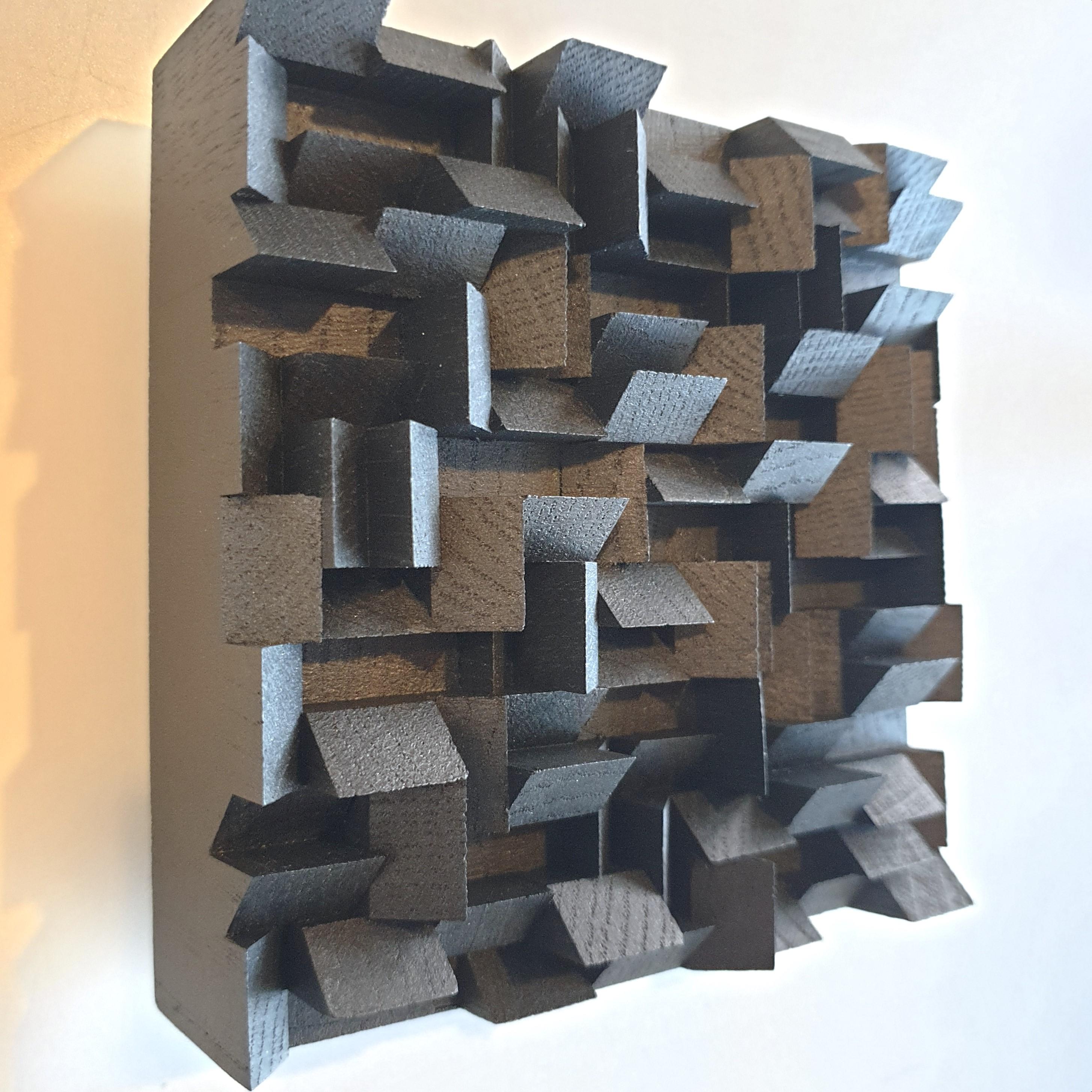 This Variation triptyque wall sculpture consists of three different small size contemporary modern abstract wall sculptures by French-Dutch artist Olivier Julia. These wall sculptures are each made individually from carefully cut, glued and sanded