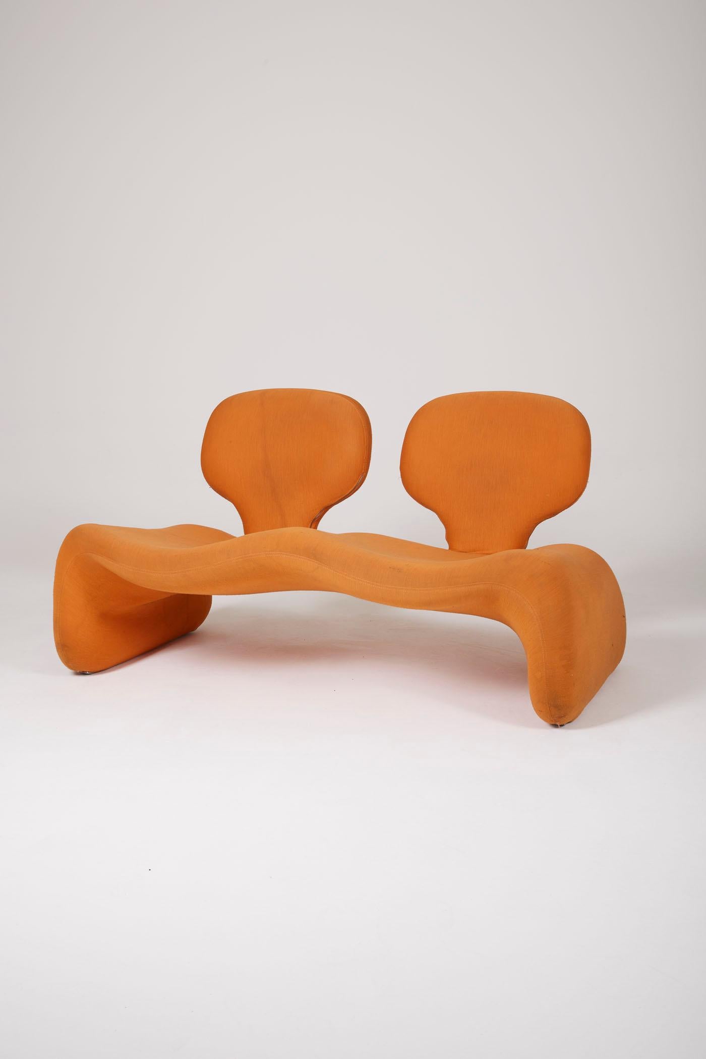 Two-seater sofa model Djinn by French designer Olivier Mourgue for Airborne, 1960s. Metal frame padded with foam and covered in its original red Kvadrat fabric. This sofa gained fame through Stanley Kubrick's 2001: A Space Odyssey. It is ready for