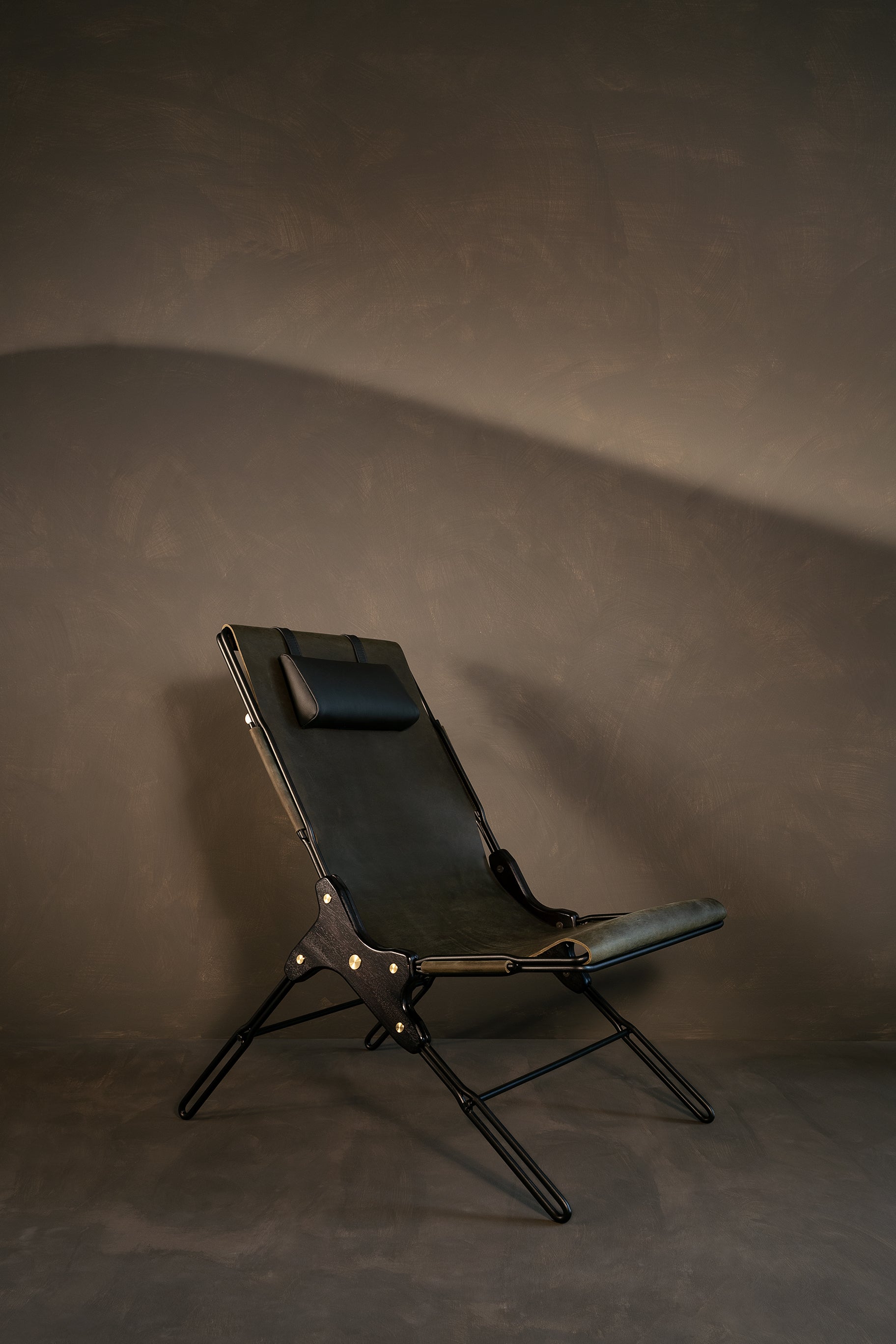 Olivo lounge chair by Estudio Andean. 
Dimensions: W 56 x D 83 x H 93 cm
Materials: steel, bronze, wood, leather.

Lounge chair made of steel rod structure and solid colorado wood with a natural oil finish, Ecuadorian sustainable cowhide leather