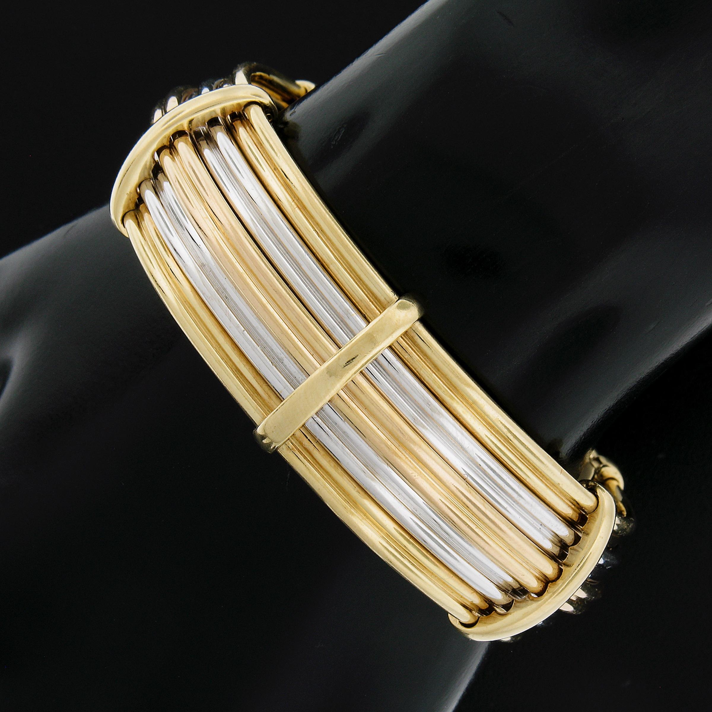 A top notch design with gorgeous thick polished wire. A testament to Italian workmanship and design in gold! Enjoy!

Material: Solid 18k Yellow & White Gold w/ Rose Gold Center
Weight: 49.23 Grams
Type: Wire Open Cuff Bracelet
Length: Will fit up to
