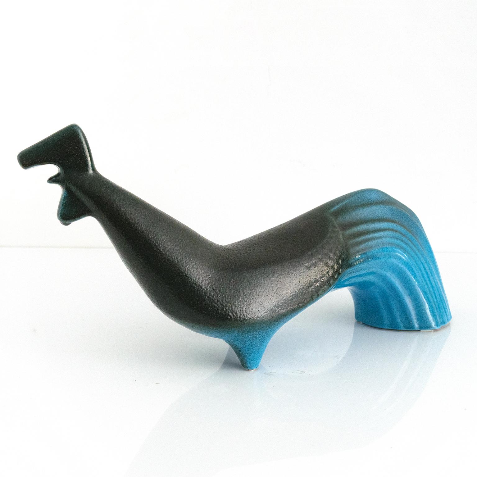 Swedish mid-century figurine designed by Olle Alberius for Upsala Ekeby. The pieces is glazed in a matte black glaze and shiny saturated blue. Signed on bottom. Made in Sweden circa 1960

Measures: Length: 17“ Height: 8.25” Width:” 4.75”.