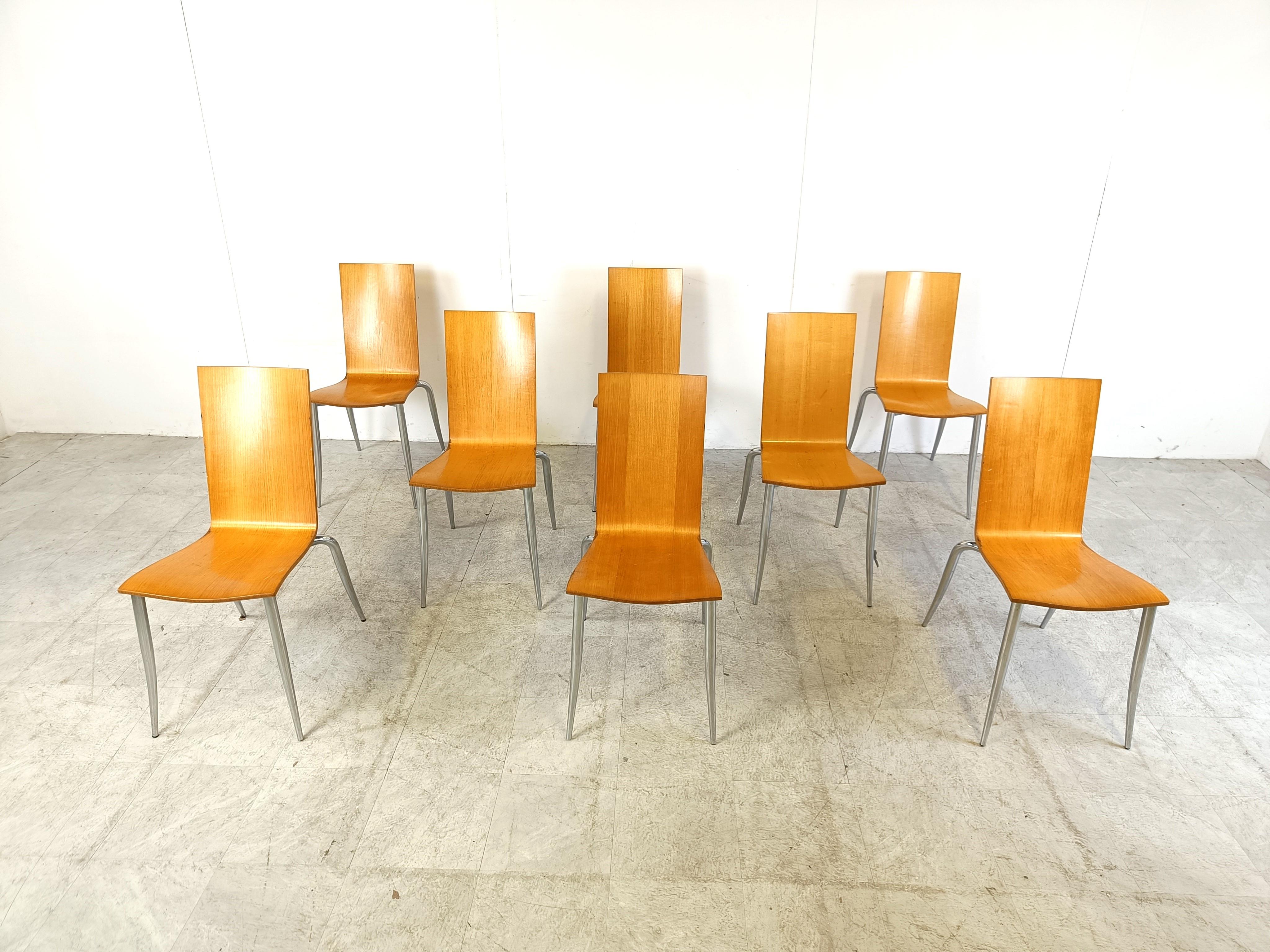 Set of 8 post modern 'Olly Tango' stackable dining chairs by Philippe Starck for Aleph.

Elegant design with chromed legs and wooden seats.

Good condition

1990s - Belgium

Dimenions:
Height: 90cm/35.43