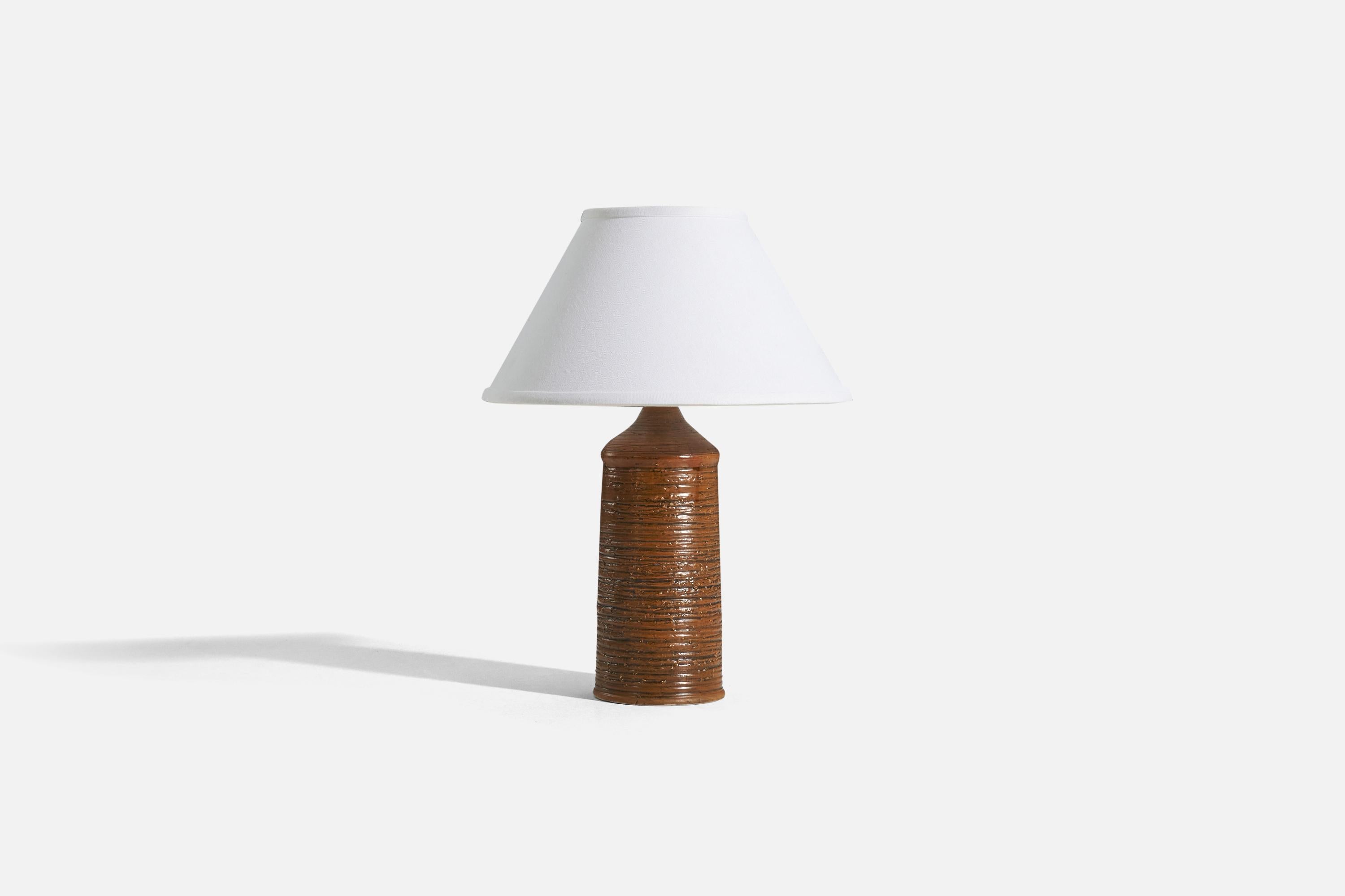 A brown-glazed stoneware table lamp designed by Olof Georg Hermansson (1915-1988) and produced for his own studio 