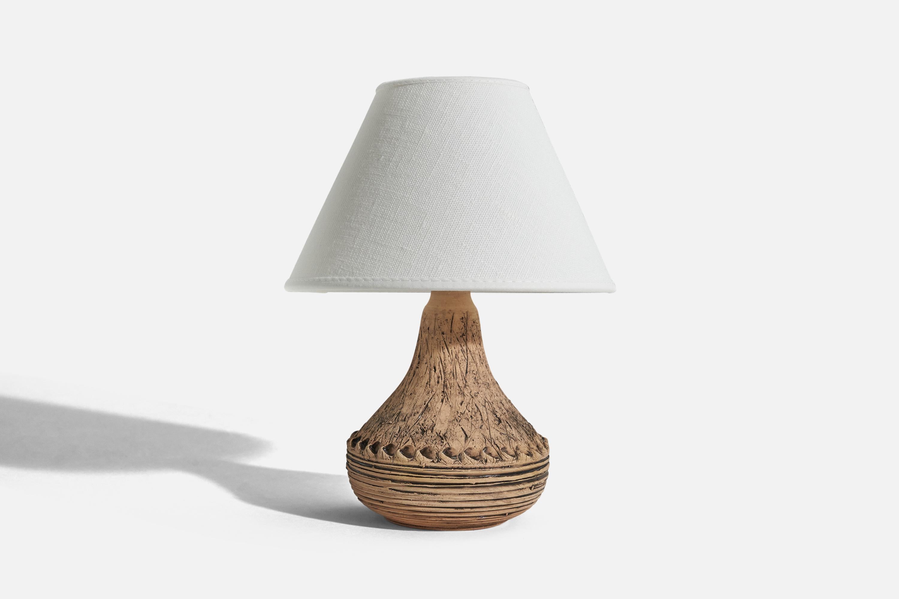 A brown, earthenware table lamp designed by Olof Georg Hermansson and produced by his own studio 