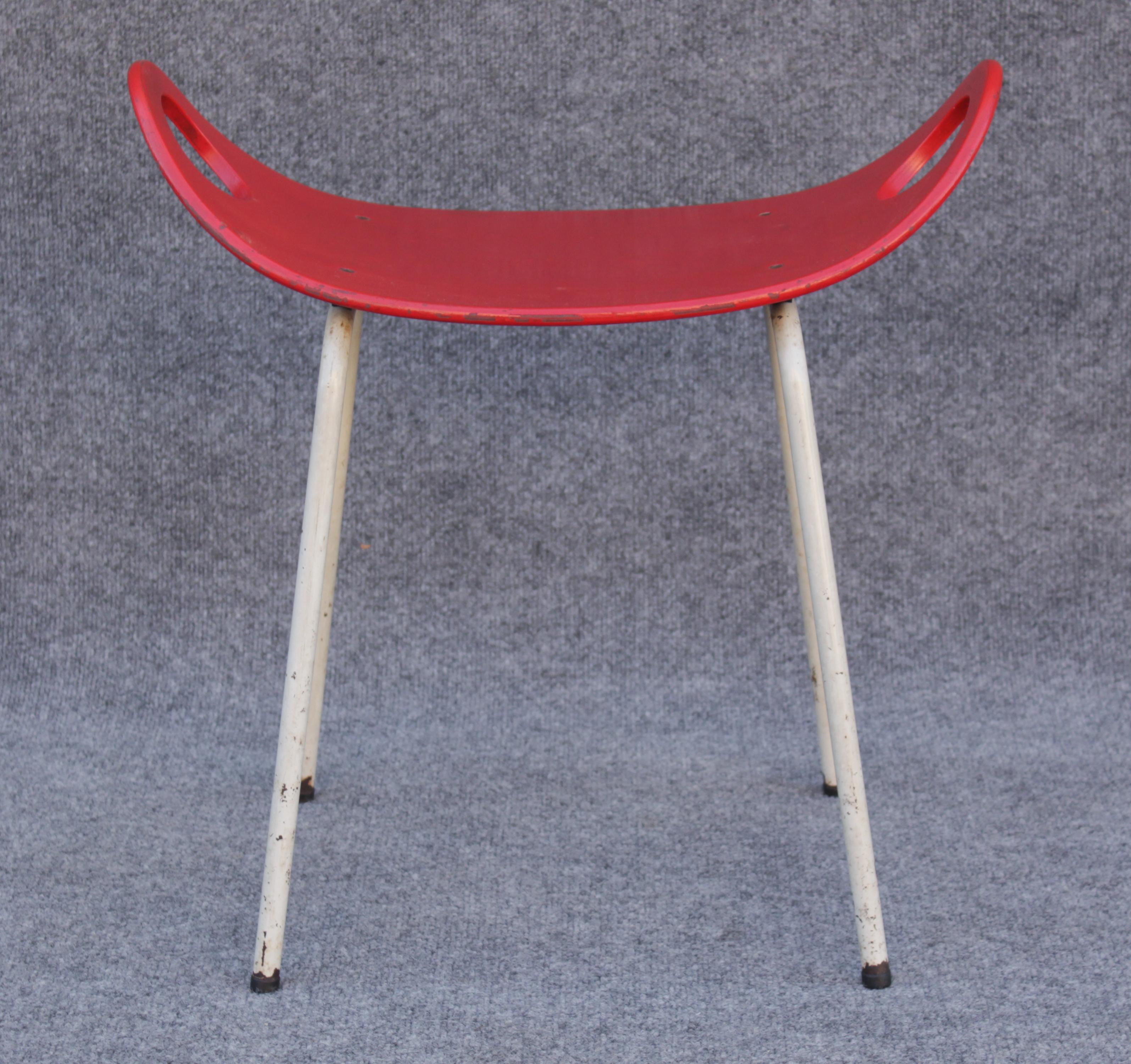 Designed in the 1950s by Olof Kettunen, this example is one of the few imported into the US by Stendig. Stendig wasn't around for a very long time, and no longer has any active showrooms. Manufactured by J. Merivaara in Scandinavia, it has a seat of