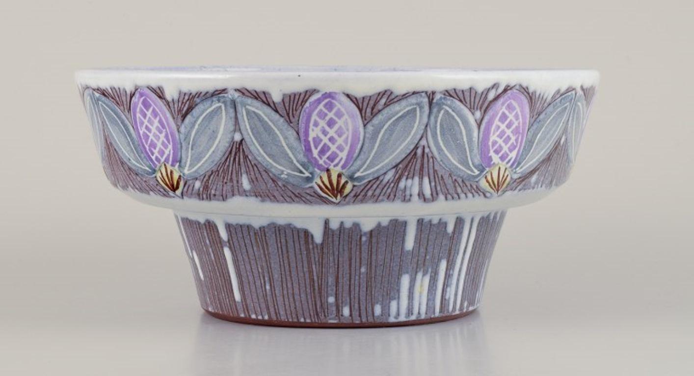 Olof Larsson for Laholm, Sweden. 
Ceramic bowl with polychrome glaze and floral motifs.
Model 783.
Circa 1960.
Marked.
In perfect condition.
Dimensions: Diameter 20.5 cm x Height 9.5 cm.