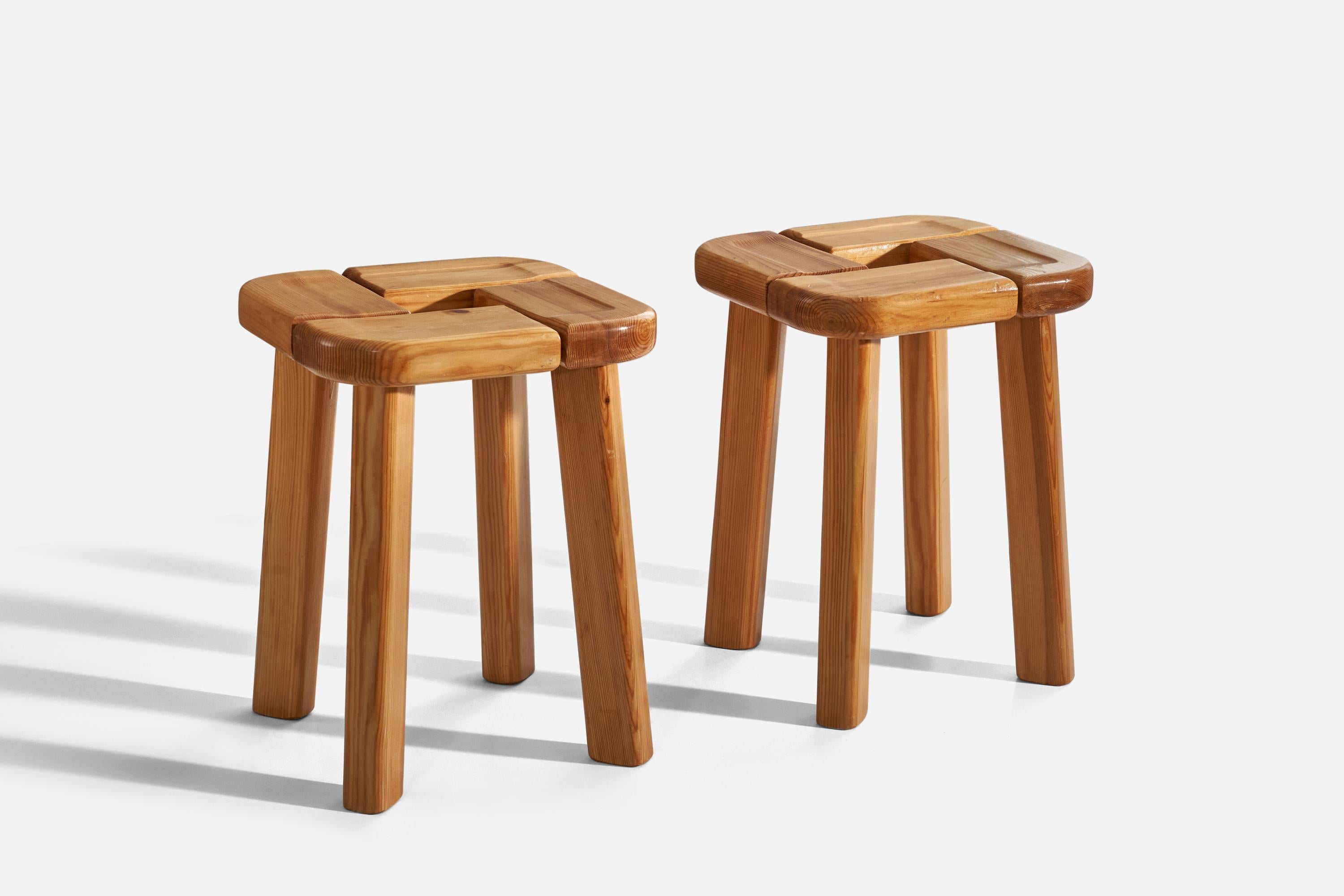 A pair of solid pine stools designed and production attributed to Olof Ottelin, Finland, 1960s.

