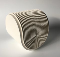 Oloid is a Contemporary Table Sculpture, with Geometric Design