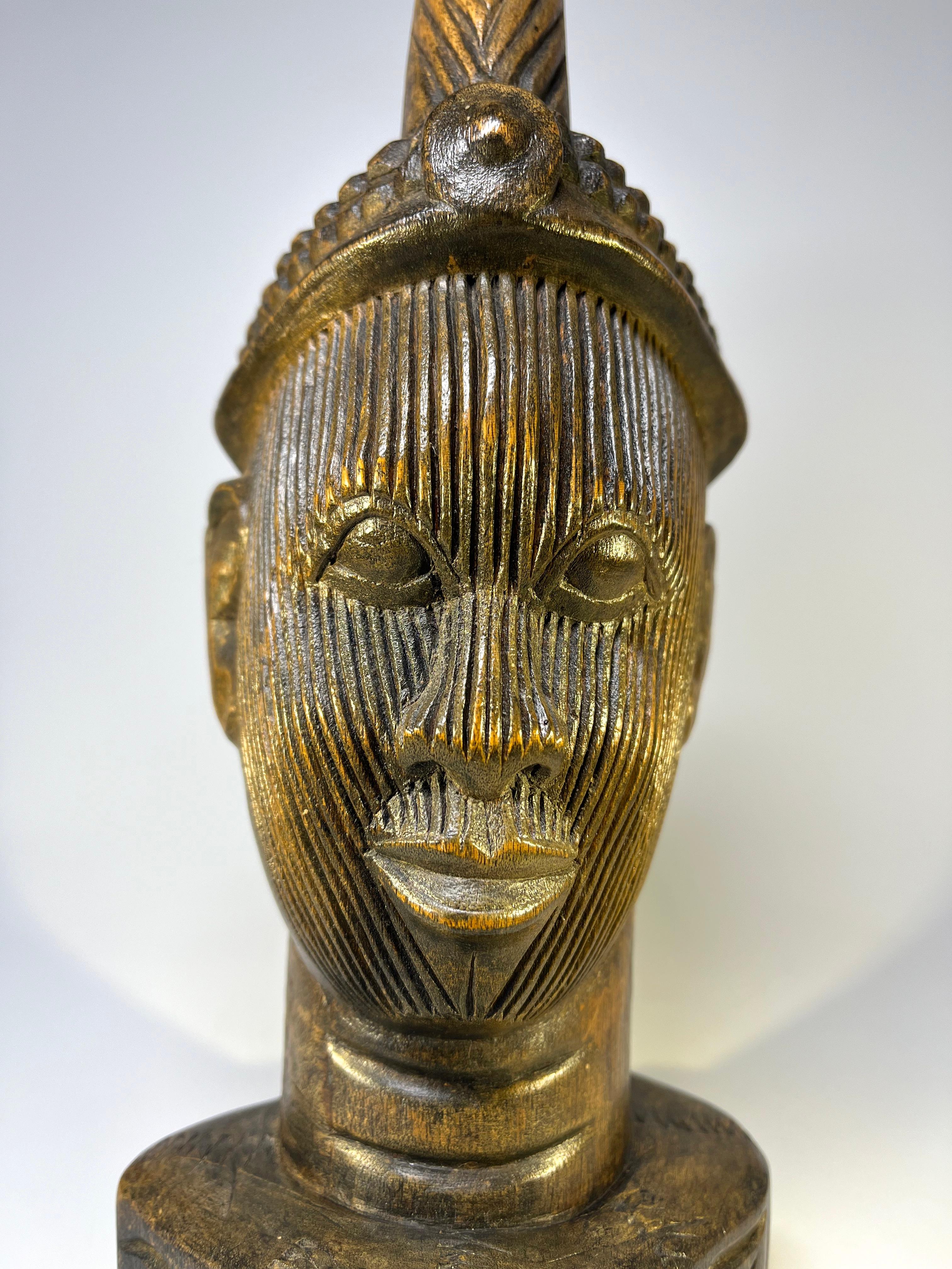 Fascinating detailed Olokun head from the Kingdom of Ife in Western Nigeria.
Hand carved hardwood face with almond shaped eyes, neck creases and astounding facial incisions
Circa 1970
Measures: height 12 inch, width 4.5 inch, depth 4.5 inch
In