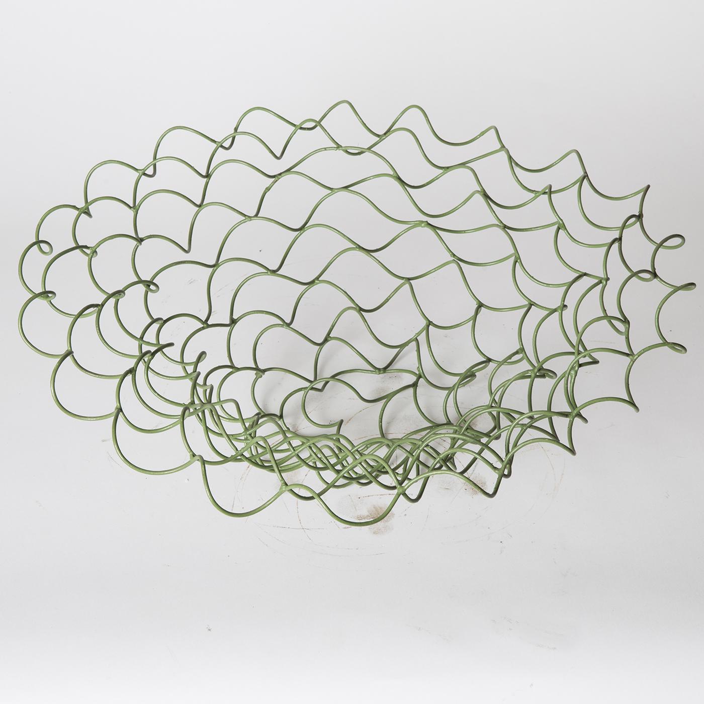 This sculptural vase by Sciortino is formed of tempered iron wire with a painted finish of various shades of green, lending the unruly geometry of the piece a distinct vivacity. Product dimensions may vary slightly. 



  