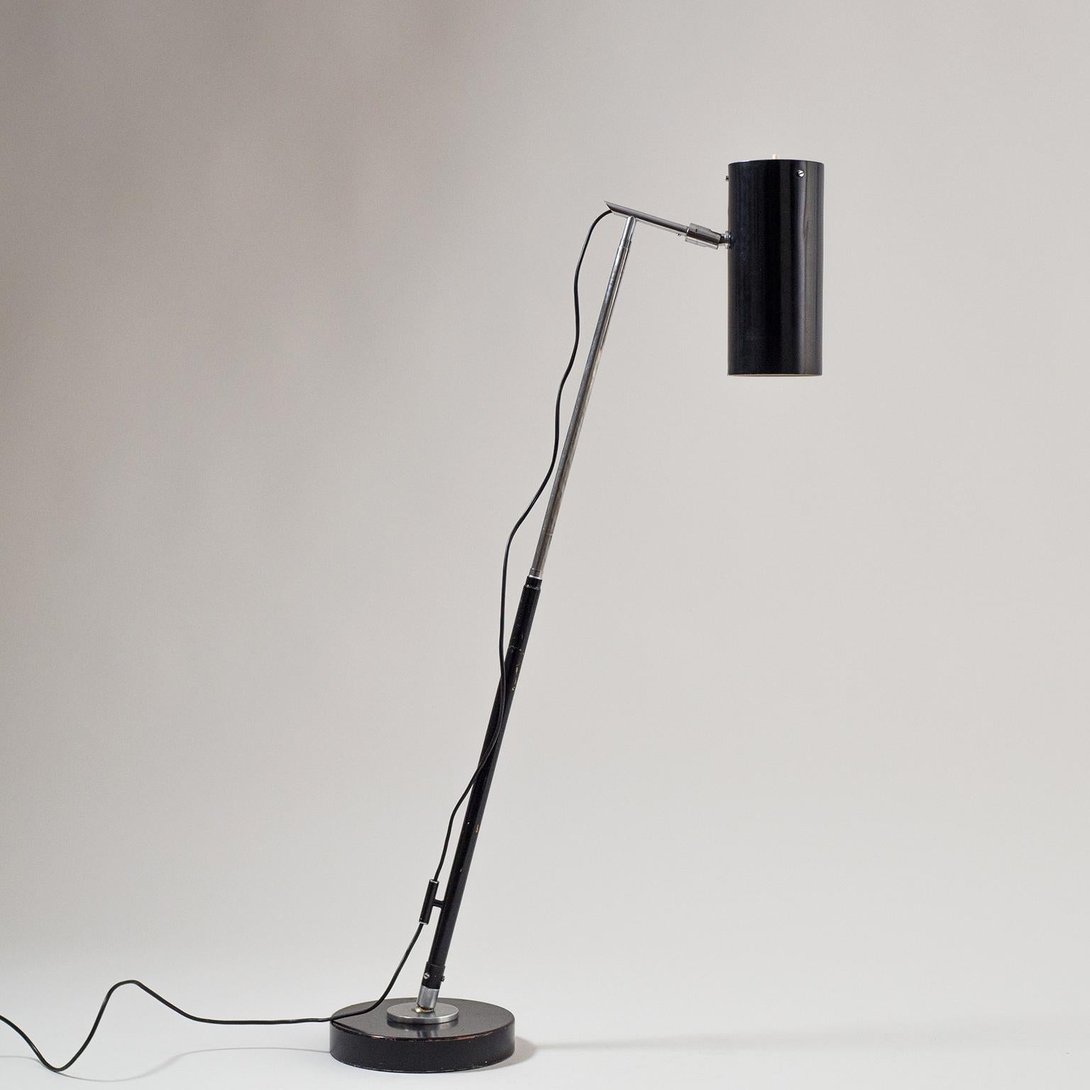 Rare model 201 telescopic floor and table lamp designed by Angelo Ostuni and Renato Forti for O-Luce, circa 1950. This version is in black with nickelled hardware, a cast steel base and a rare cylindrical shade with light switch on top. The