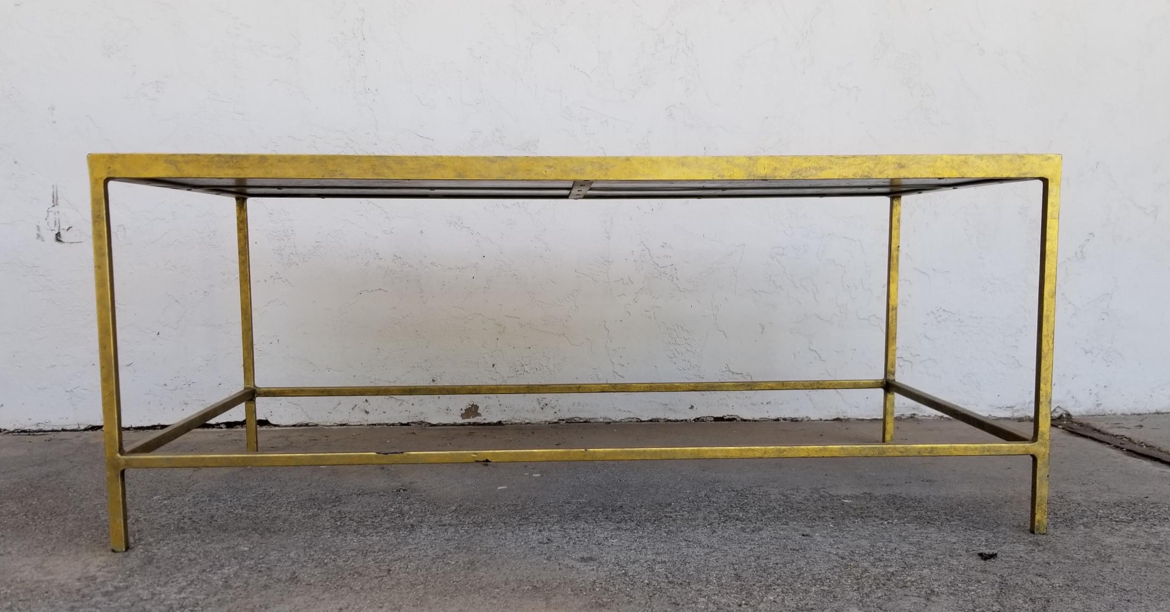 Elegant tortoise shell rectangular coffee table with gold finish to welded iron base. Created by Oly Studio, late 20th century. Makers mark on base. Age appropriate wear.