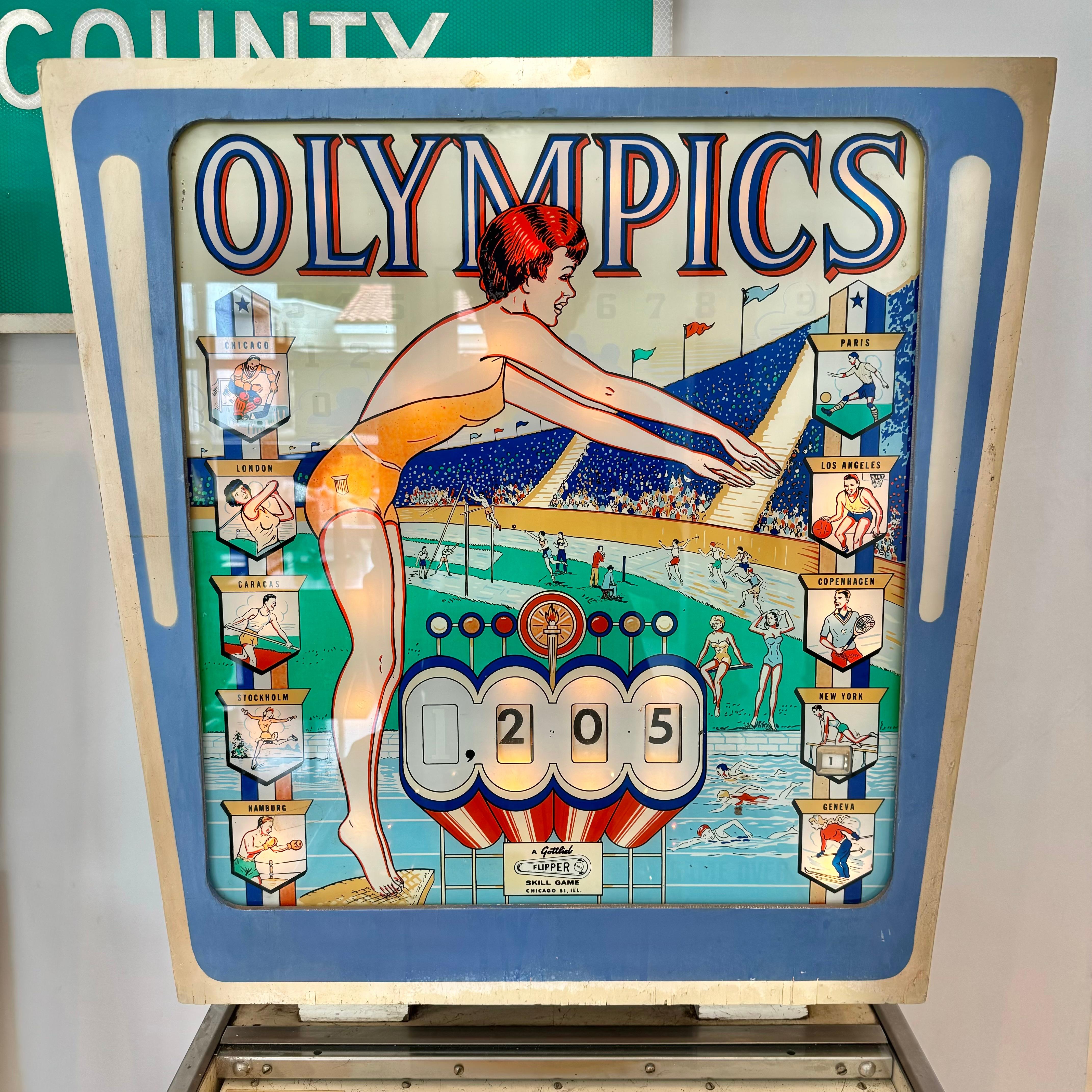 Vintage 'Olympics' pinball machine from 1962. Designed by Wayne Neyans and manufactured by D. Gottlieb & Company. 2,200 units produced in total. In excellent working condition. Great visuals and sounds. Extremely fun paced gameplay. 

This game