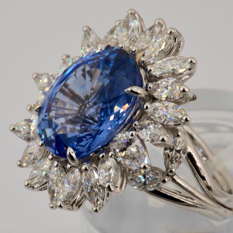 18 Carat 750 White Gold
3.86 Carat Diamond Marquise Cut
11.65 Carat Sapphire

Unique Art Design
Olympus Art Certified
Blue Daisy Ring