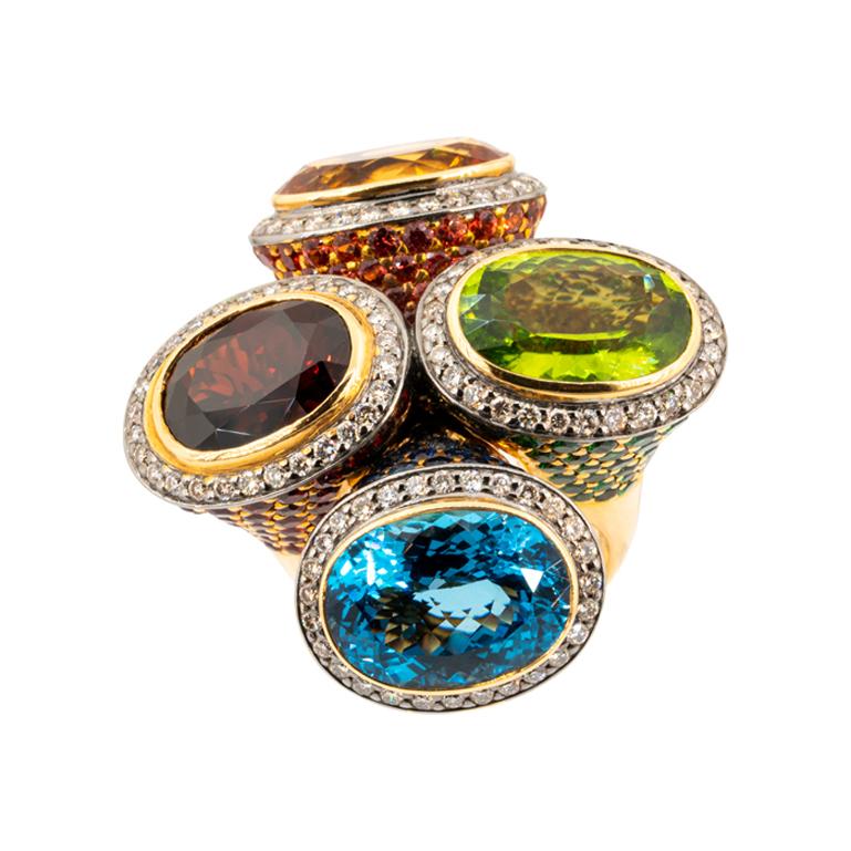 Olympus Art Certified, Ottoman Style 4 COLORS Ring
Rose Gold 18 K, Diamond 1.45 Carat, Sapphire 2.53 Carat, Tsavorite 3.05 Carat, Blue Tapaz 14.25 Carat.
Citrine 7.60 Carat, Peridot 6.90 Carat, Garnet 7.25 Carat, Red Sapphire 5.54 Carat