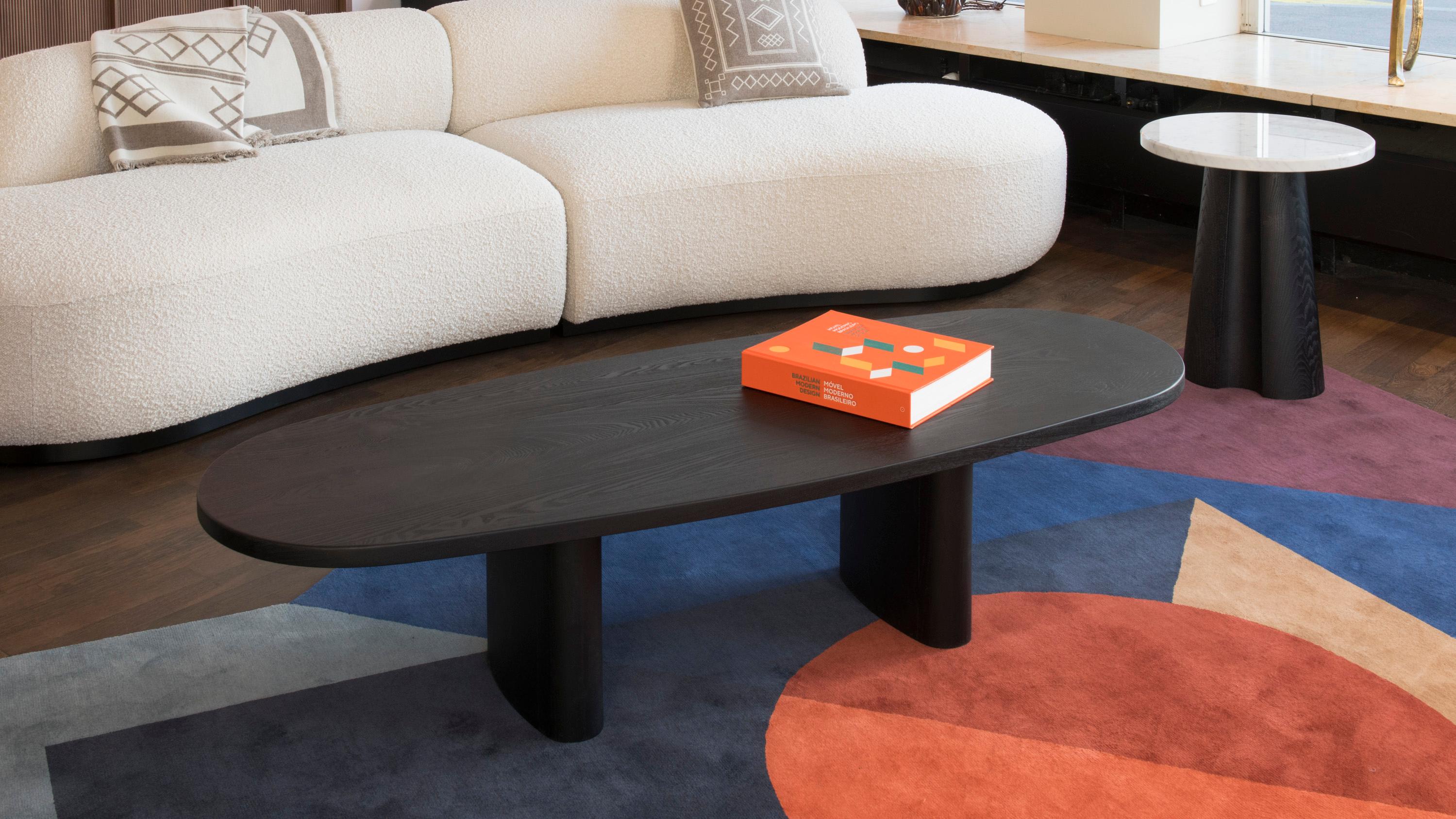 Black stained & brushed ash coffee table. His free oval top and feet shape offer a soft and warm design. This low table fit perfectly with a curved sofa and armchairs.
Designed by Olivier Moravik from Parisian based design studio mjiila, handmade