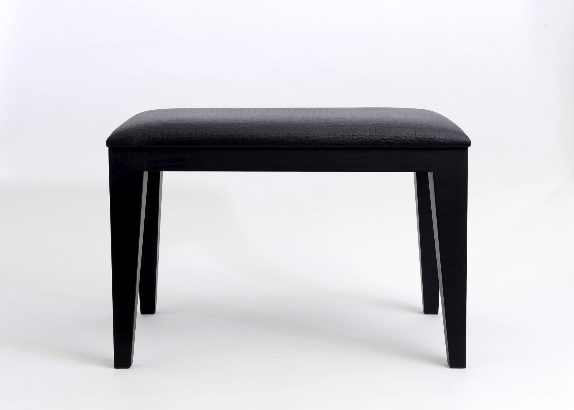 Small bench or ottoman in solid french stained black ash. Padded seat with polyurethan foam, upholstered with crocodile style embossed black cow leather.
Seat high is 41 cm so perfect to put on your shoes easily. This occasional seat can fit well as