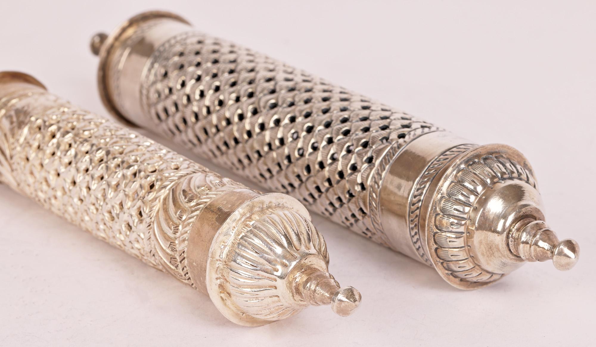 Two fine graduated vintage Omani silver pierced scroll or document holders believed to date to the early to mid 20th century. The scroll holders are of long hollow cylindrical shape with decorative finials to either end, one doubling up as a