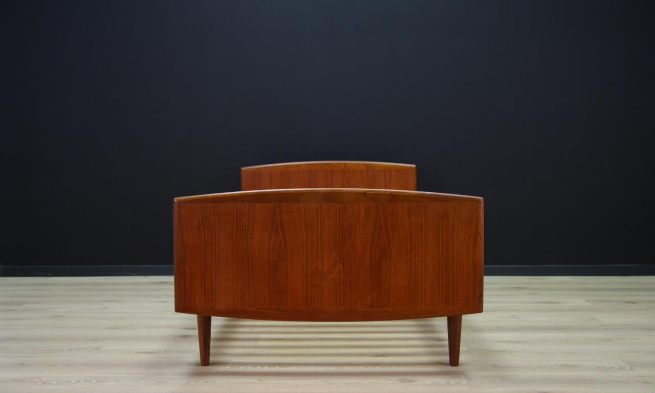 Scandinavian bed from the 1960s-1970s, a minimalistic form made for the Omann Jun manufacture. Construction veneered with teak, teak legs. Preserved in good condition (minor scratches and bruises) - directly for use.

Dimensions: height 65 cm,