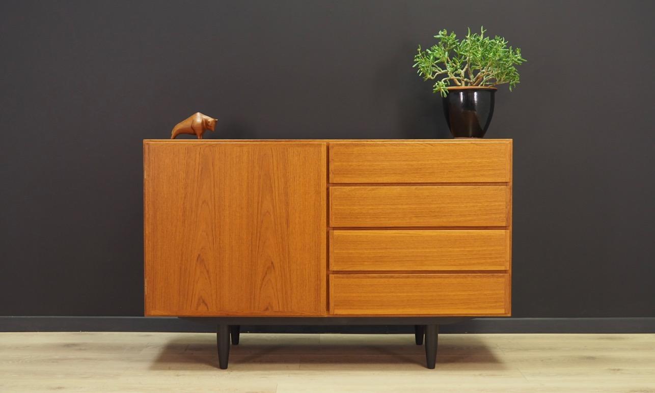 Brilliant cabinet from the 1960s-1970s. Danish design - Minimalist form. Manufactured by Omann Jun. The furniture finished with teak veneer. The chest has four packing drawers and a shelf. Maintained in good condition (minor bruises and scratches)