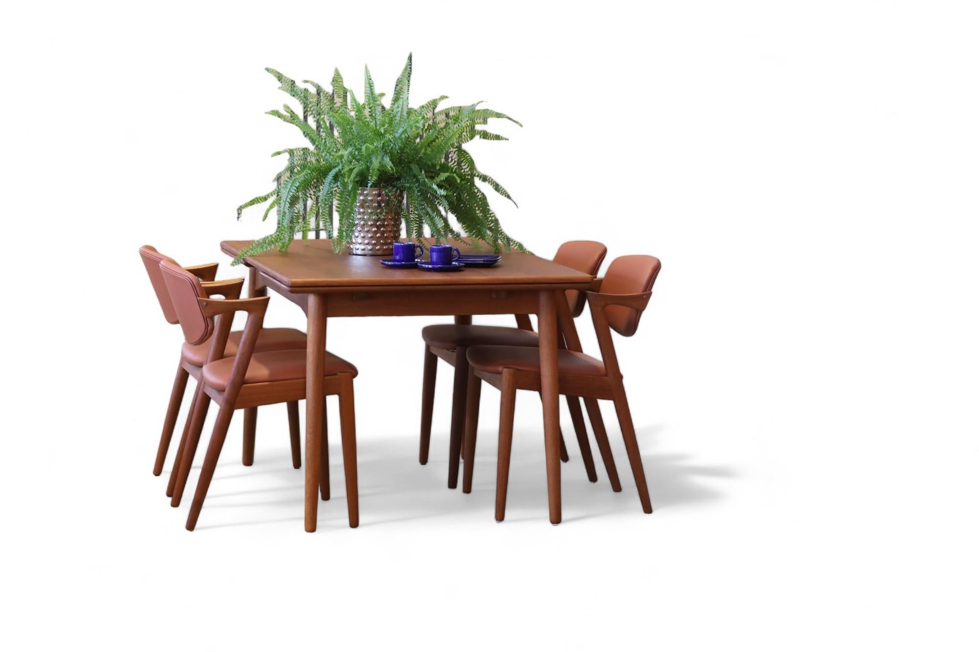 
A flexible and exquisitely beautiful dining table designed by Omann Jun for Omann Jun Møbelfabrik in Denmark. The table is in teak and in model 50.

The table top has rounded corners and a frieze, which means that the table top is framed. In the