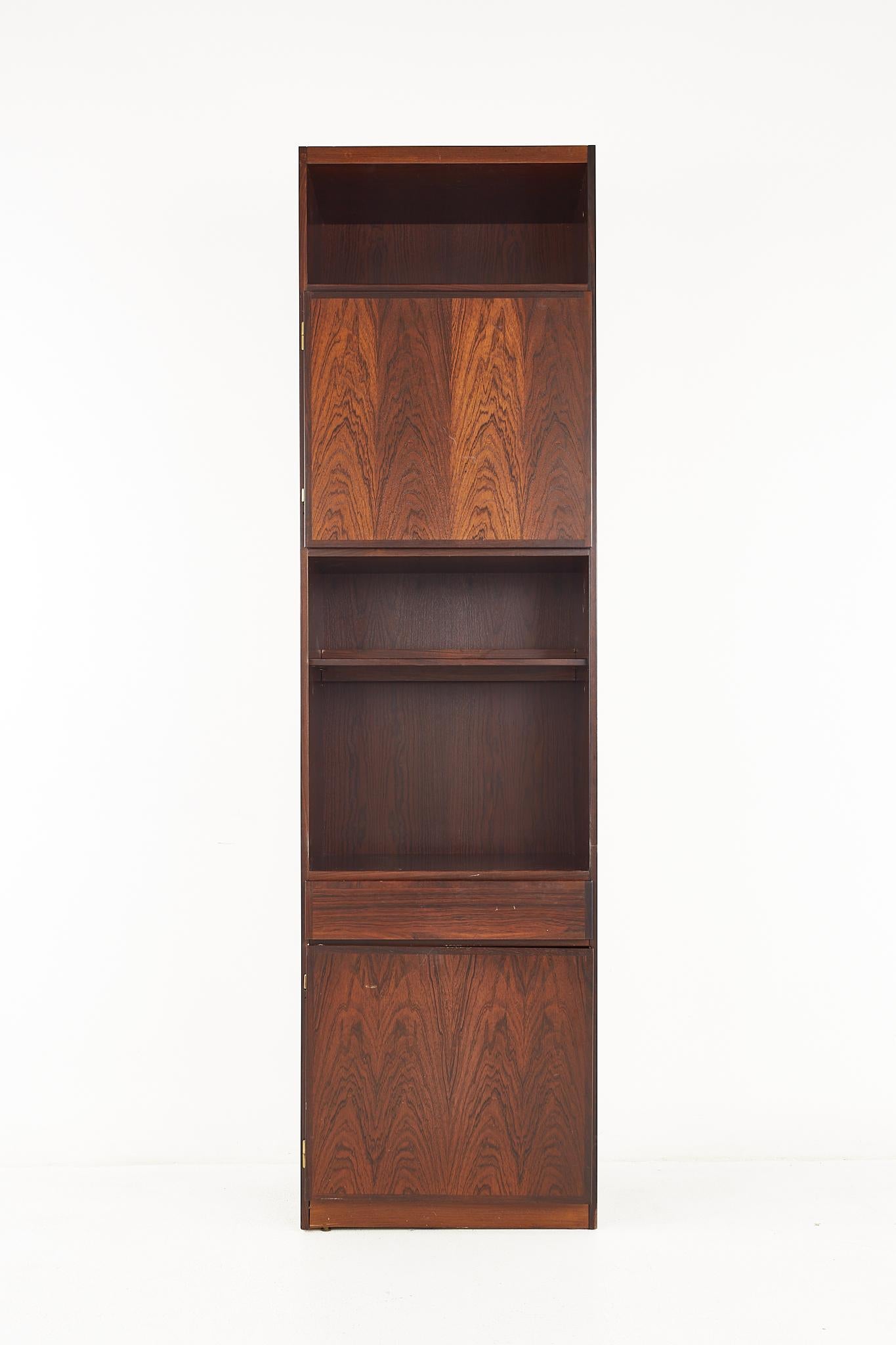 Omann Jun mid century danish rosewood bookcase cabinet

This cabinet measures: 23 wide x 16 deep x 84 inches high

All pieces of furniture can be had in what we call restored vintage condition. That means the piece is restored upon purchase so