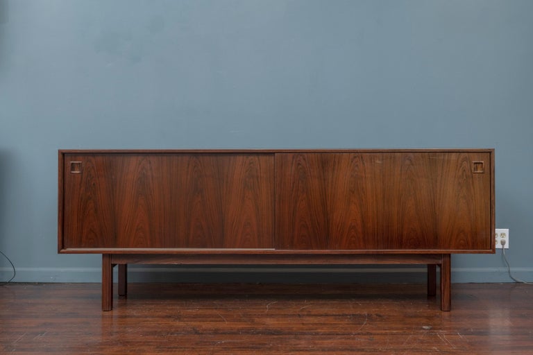Omann Jun design rosewood credenza model 21, Denmark. Simple yet sophisticated credenza made from high quality material and construction with adjustable shelf and drawers and a finished back. In very good original condition and ready to install and
