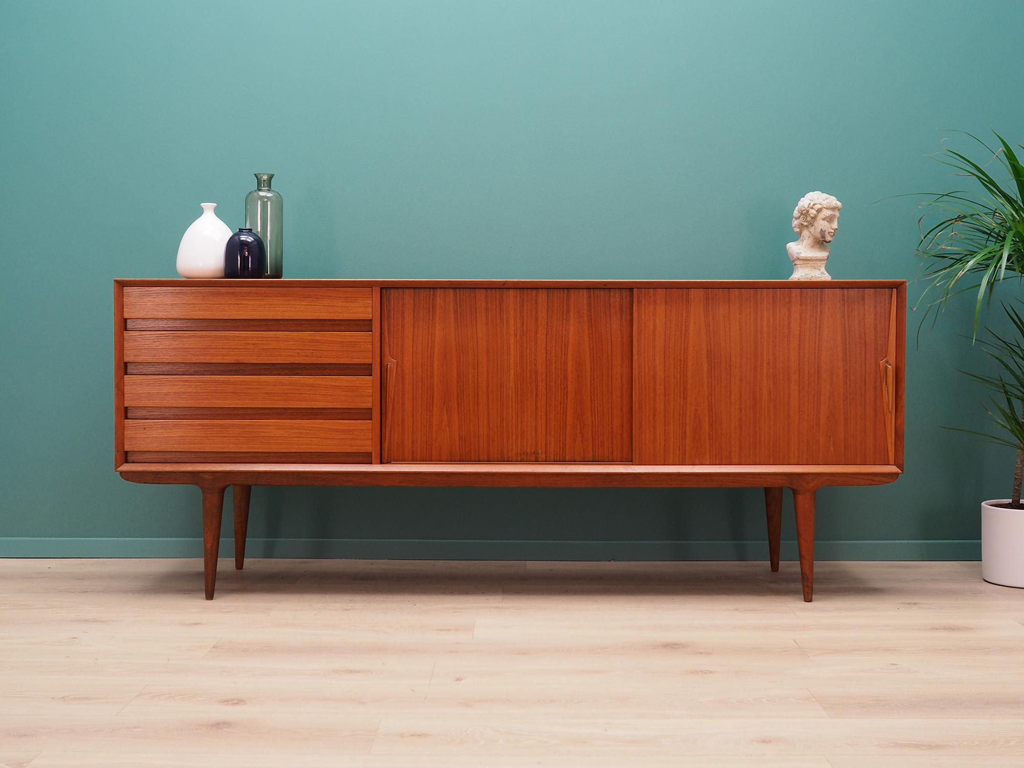 Brilliant sideboard from the 1960s-1970s. Scandinavian design, Minimalist form, excellent workmanship, attention to detail. Model #18 manufactured by Omann Jun. The surface of the furniture is finished with teak veneer. Sideboard has four packed