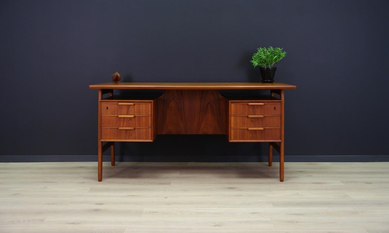 Classical desk from the 1960s-1970s, Scandinavian design produced in the Omann Jun manufacture, Gunni Omann project. Furniture veneered with teak. It has six capacious drawers, two bookshelves at the back of the bar. Preserved in good condition