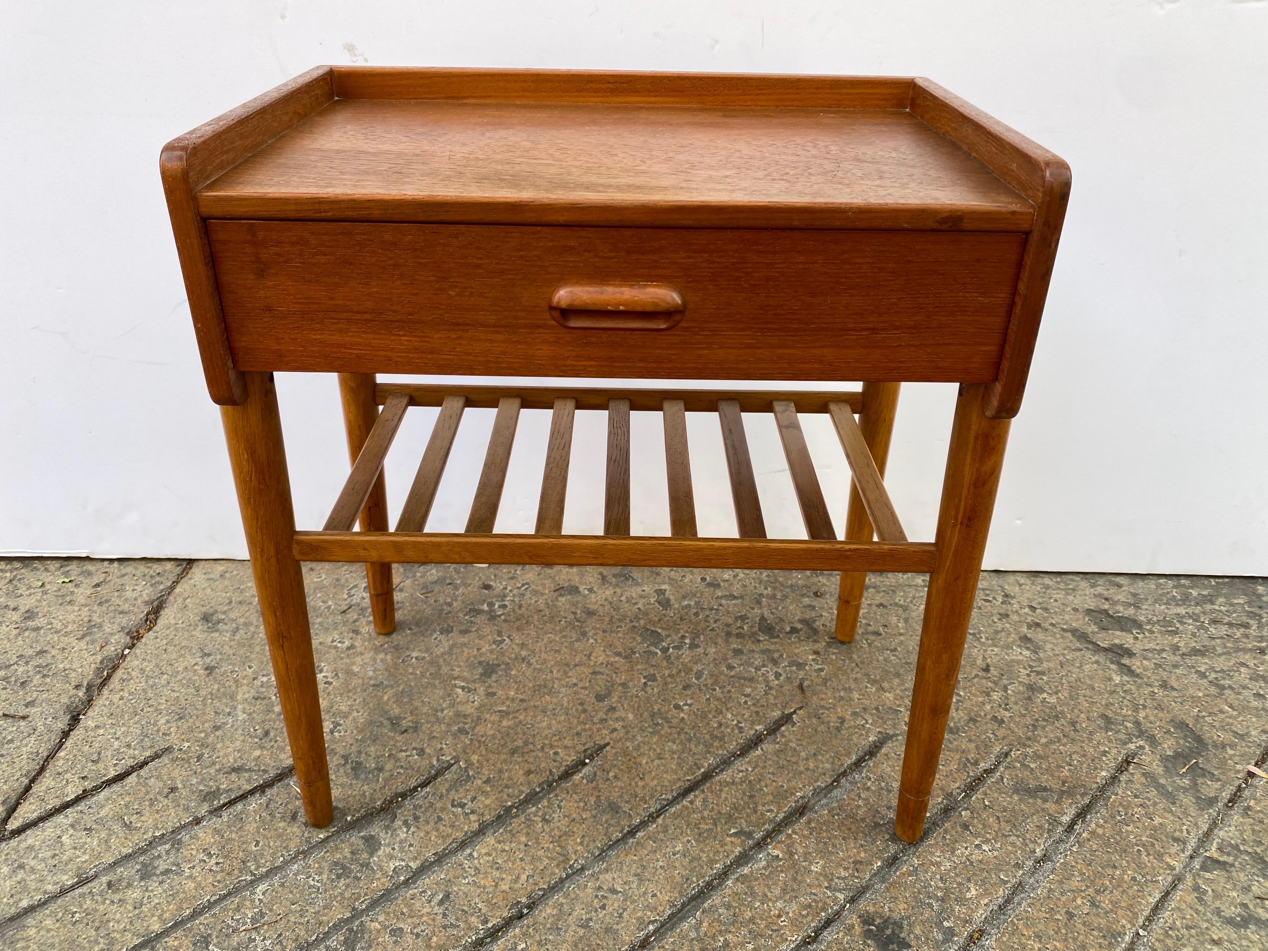 Omann Junior Teak Nightstand. One pull out drawer and rack below. Nice Original condition!
