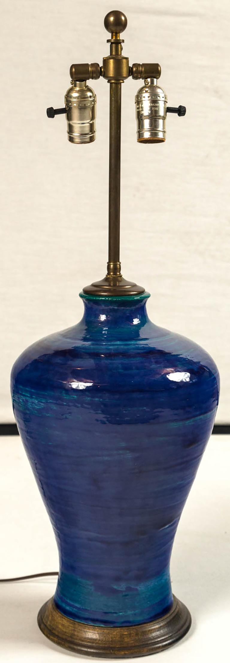 Ombre glazed ceramic table lamp, 20th century. A richly glazed ceramic lamp in shades of dark to lighter blue. Turned wood base. Newly wired.
