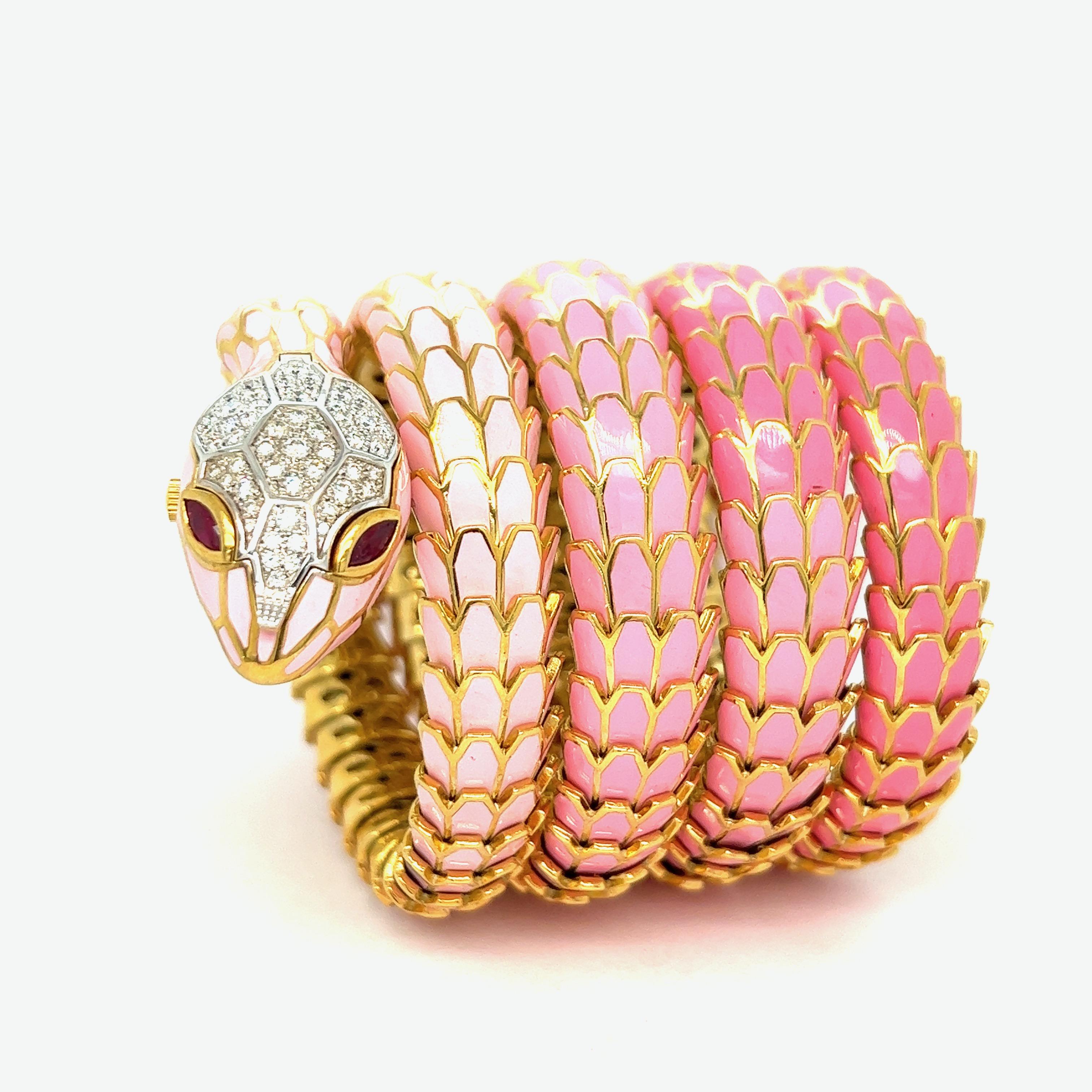 Ombré light and dark pink enamel wrap watch snake bracelet, 5 rows

Round-cut diamonds of 1.10 carats, Marquise-shaped rubies of 0.56 carat, 18 karat white gold, silver with a tone of yellow gold; marked 750, 925, D. 1.10, R. 0.56,