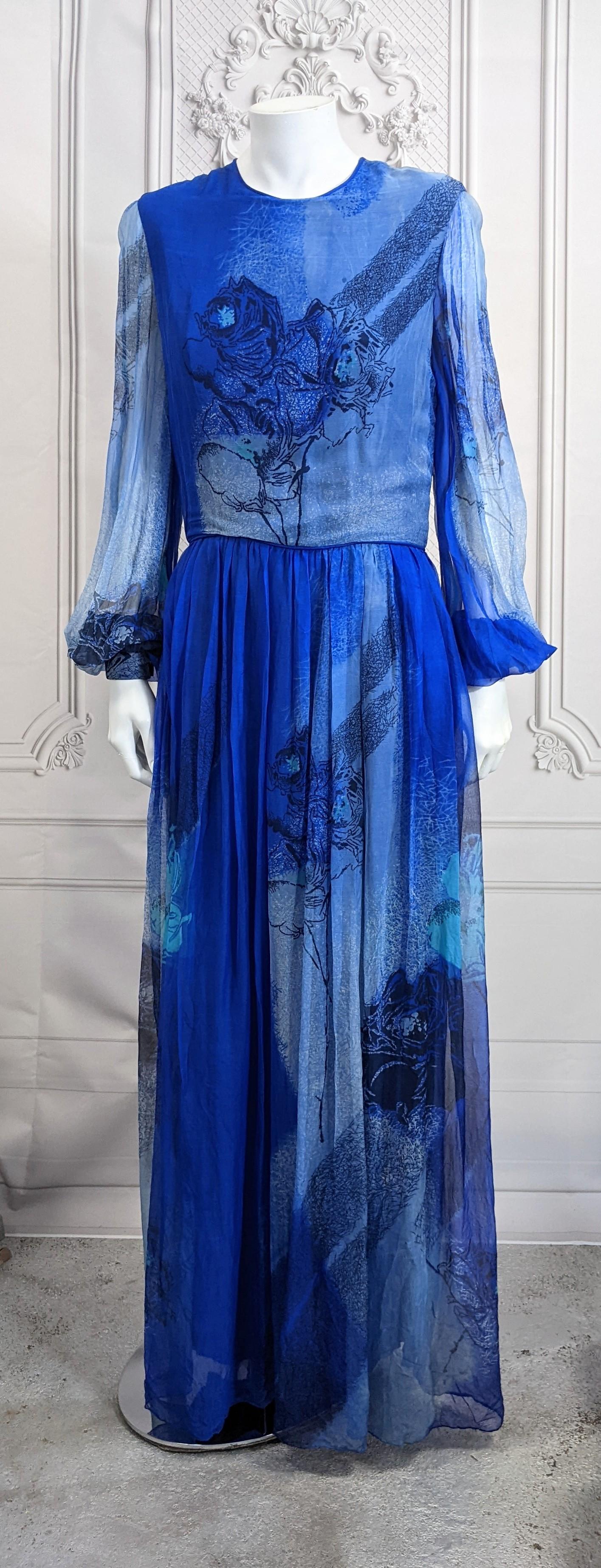 Elegant Ombre Silk Chiffon Rose Print Gown from the 1970's. Simple fitted top with full sheer sleeves and full skirt. Black overprint rose florals are perfectly placed onto the front and back of bodice. Radiating tonal blues are used with a black