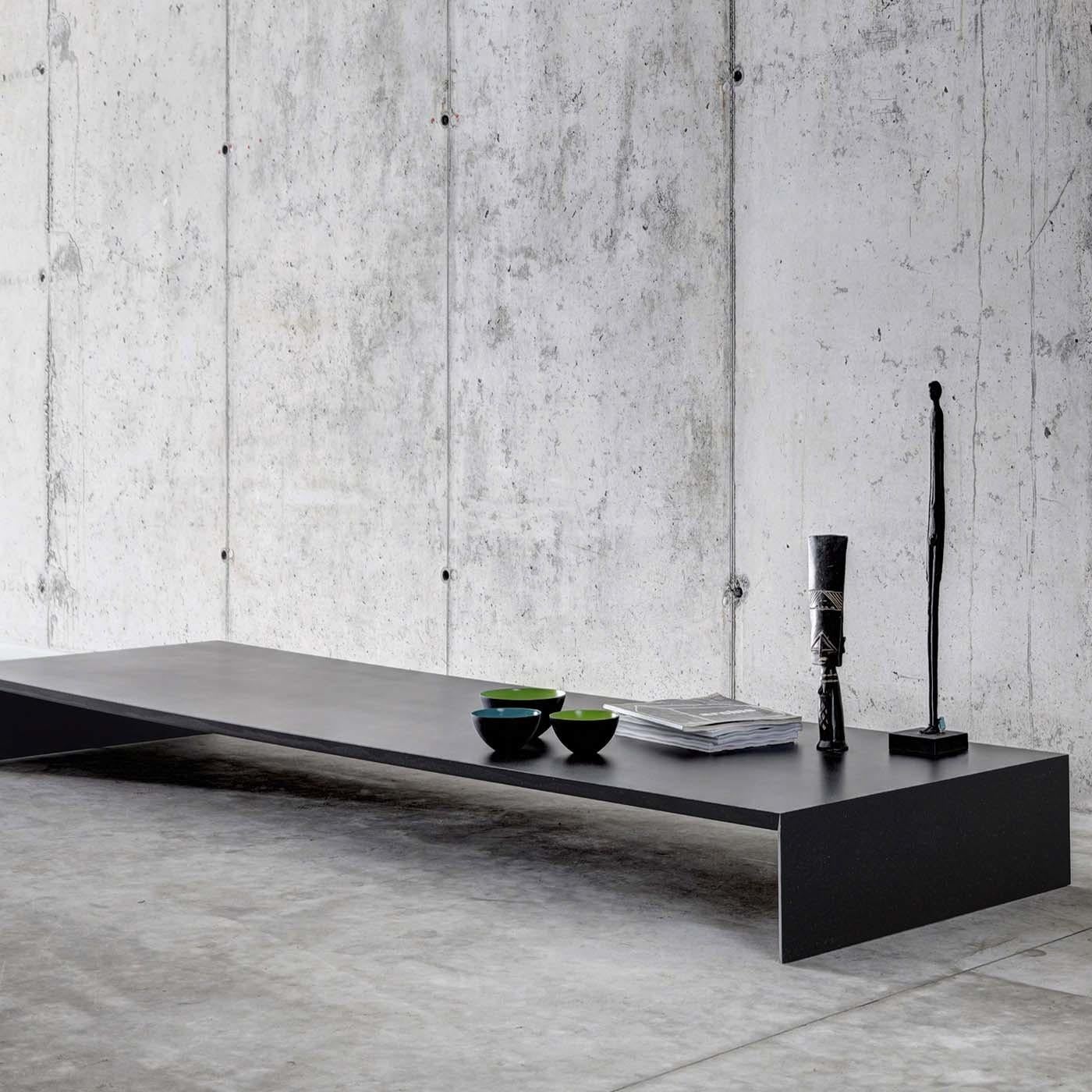 This unique low table is part of the Ombrì collection by Studio Guscetti. An object of strong visual impact, this piece will be suitable as a coffee table in an eclectic living room or as a display surface in any room of a modern home. Its long