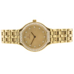Omega 18 Karat Yellow Gold Ladies Deville with Diamond Bezel