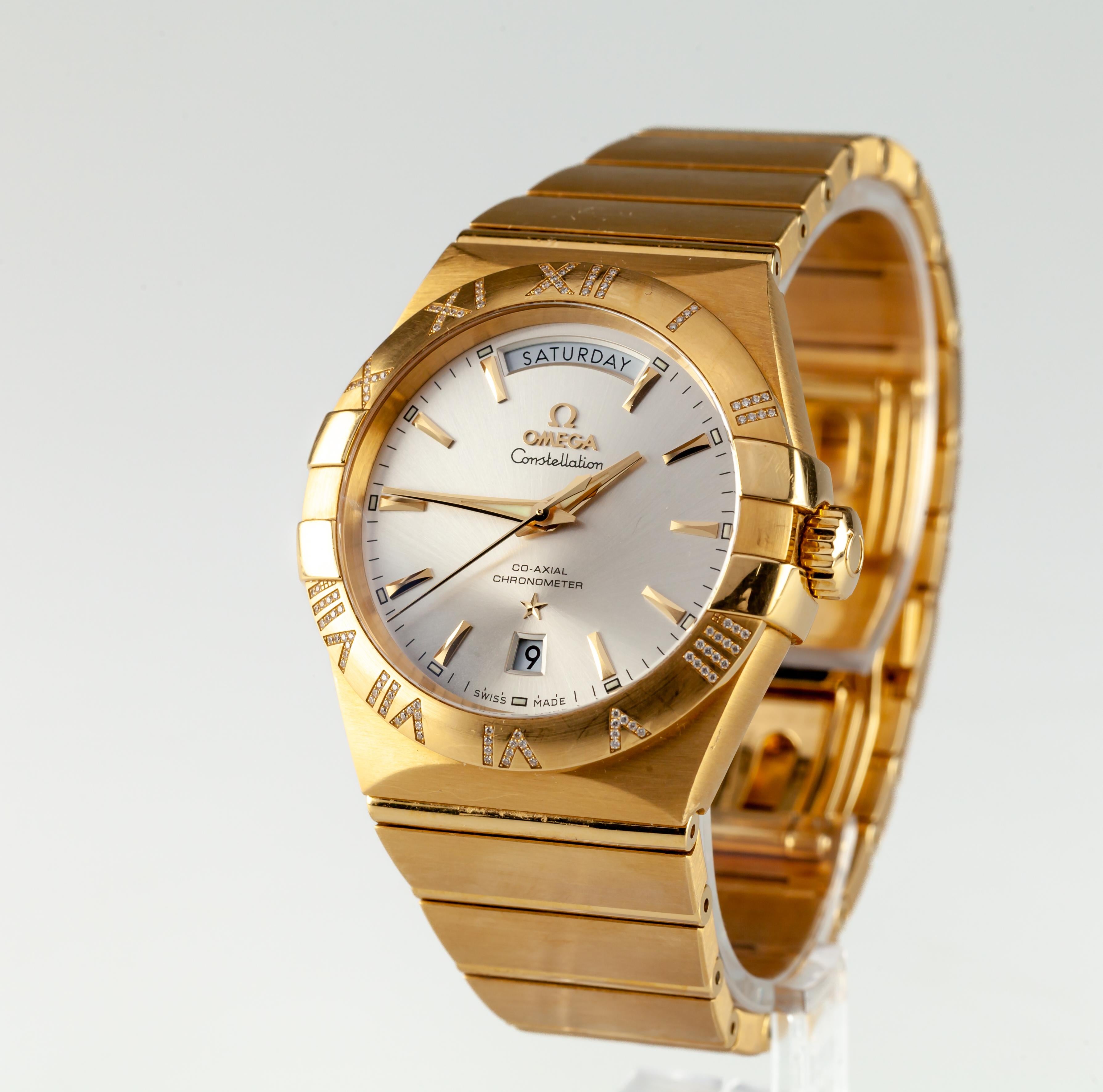 Omega 18k Gold Constellation Co-Axial Day-Date Men's Automatic Watch 38 mm



MOVEMENT 

Calibre: 

Omega 8612 Self-winding movement with Co-Axial escapement. Daydate change at midnight with instantaneous jump. Silicon balance-spring on free