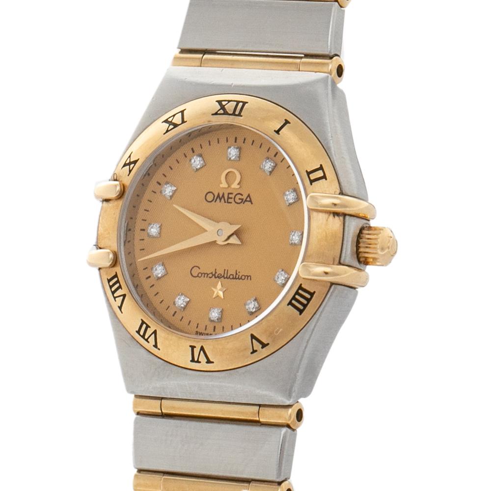 An icon from Omega, this Constellation Quartz watch for women is cast in stainless steel and 18 yellow gold. It has Roman numerals engraved on the bezel and a gold dial that holds our gaze. Set on the round dial are three gold hands and diamond hour