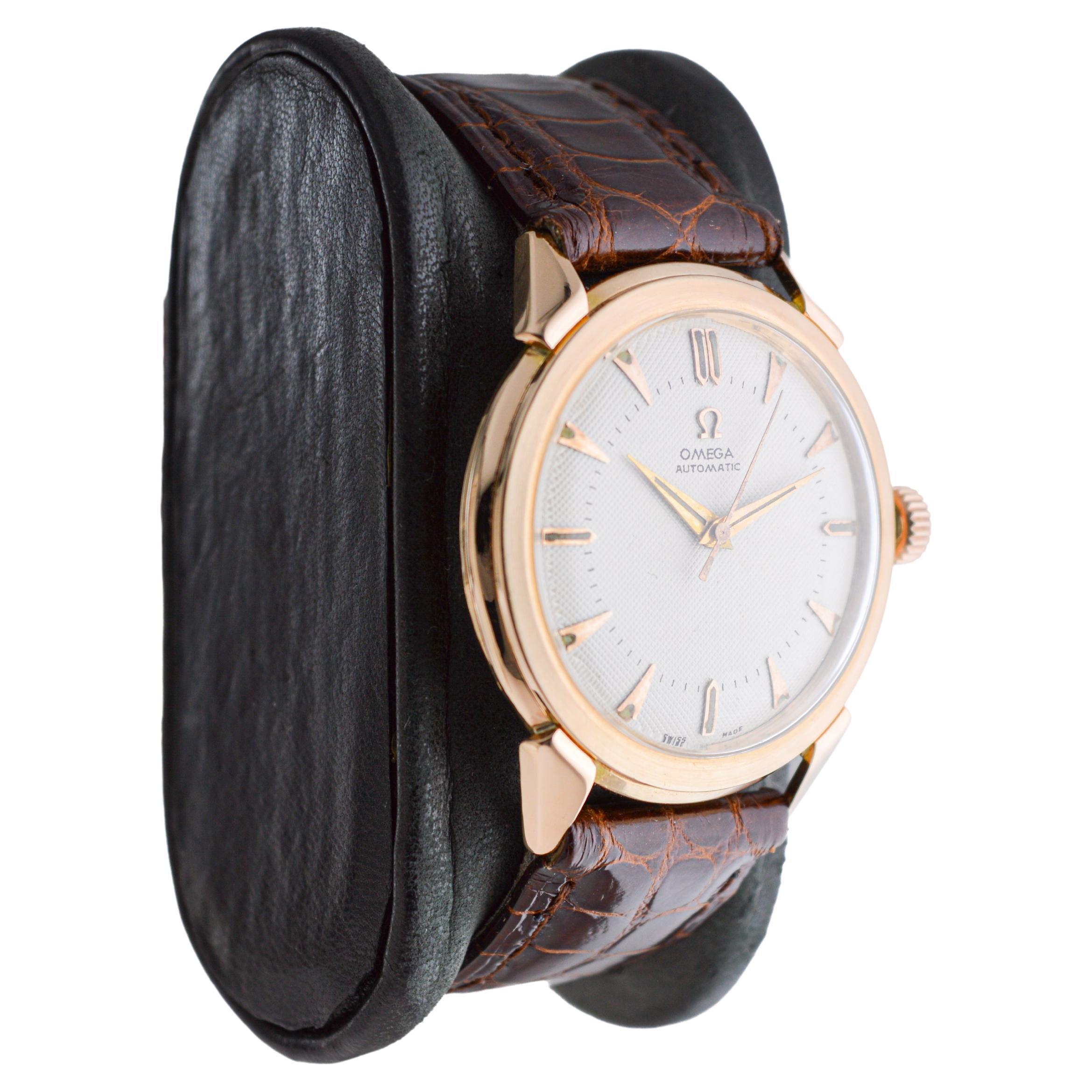FACTORY / HOUSE: Omega Watch Company
STYLE / REFERENCE: Dress Watch
METAL / MATERIAL: 18Kt Rose Gold 
CIRCA / YEAR: 1940's
DIMENSIONS / SIZE: Length 40mm X Diameter 36mm
MOVEMENT / CALIBER: Automatic Winding / 17 Jewels / Caliber 354
DIAL / HANDS: