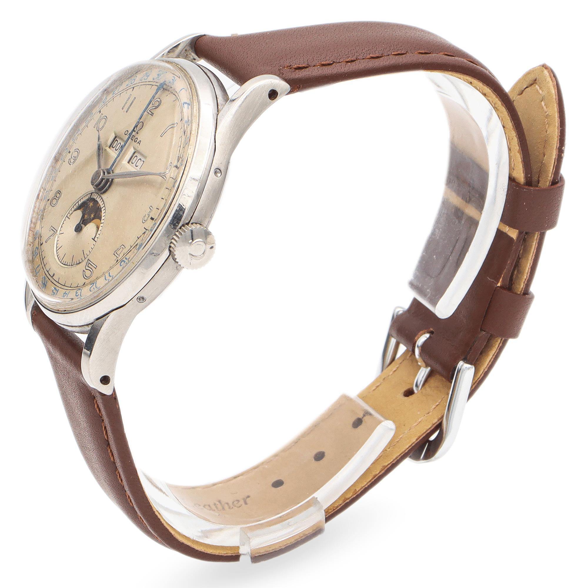 This timepiece features a 35mm watch face with a sophisticated design, showcasing a triple calendar and moon phase complication. The dial is adorned with clear numerals and a charming moon phase display at the 6 o'clock position. Crafted by Omega,